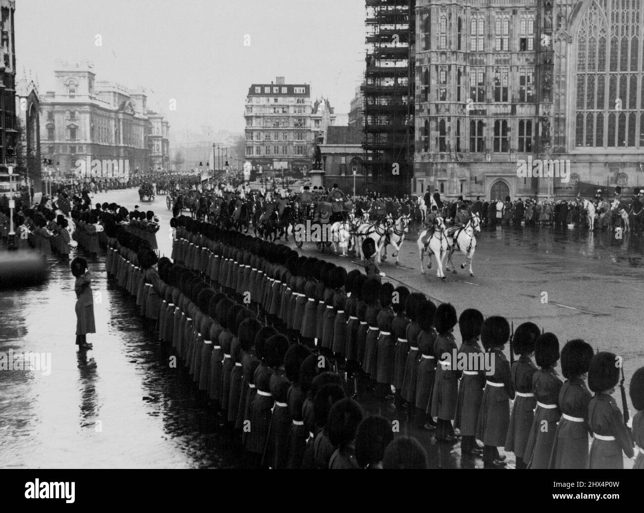The Queen Approaches The House - The winter sunshine breaks through the clouds as the Queen's landau, with an escort of the Household Cavalry, approaches the Houses of Parliament for the State Opening. November 30, 1954. (Photo by Evening Standard Picture). Stock Photo