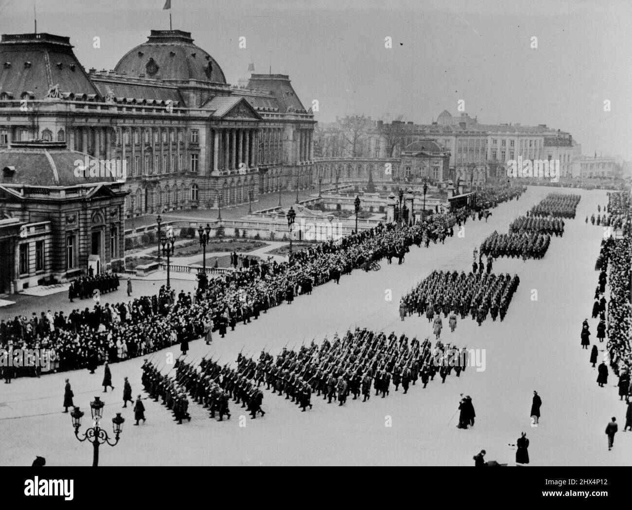 Baudouin I - The Life Story Of A Young Prince -- The great military Spring Parade; Troupes passing the Palais Royal at Brussels. April 8, 1940. (Photo by Paul Popper Ltd.). Stock Photo