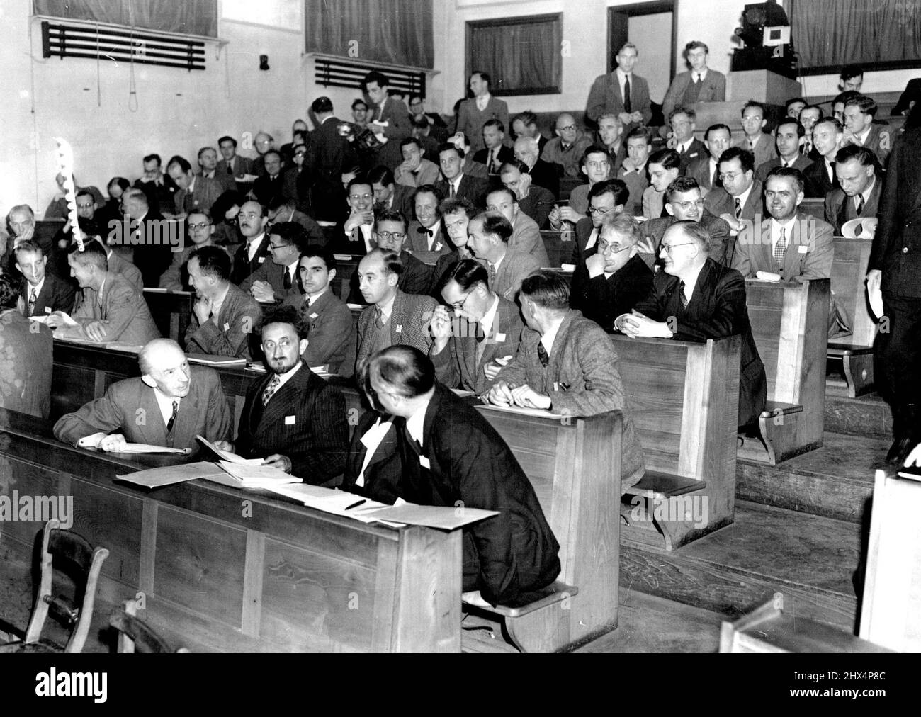 World Scientists Meet To Discuss The Atom A view of some of the 230 scientists who are attending the International Atomic Energy conference at Clarendon Laboratory here. In front row (wearing beard) is Doctor F. Perrin, of Paris, and on his left, Doctor Lise Meitner (Stockholm) and Professor P.I. Dee, of Glasgow, Scotland. September 7, 1950, Stock Photo