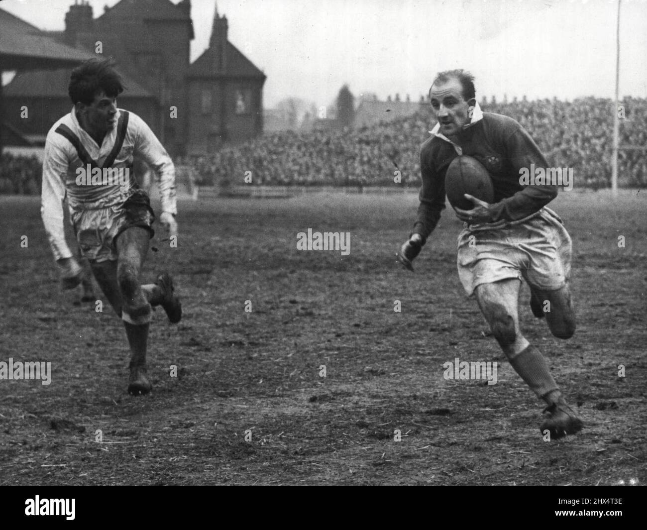Leeds Rugby League centre Lewis Jones, makes a dash during a recent trial game. Former Rugby Union player, who was in Australia with the 1950 British team, Jones could gain a place in the League team to tour Australia this year. March 09, 1954. Stock Photo