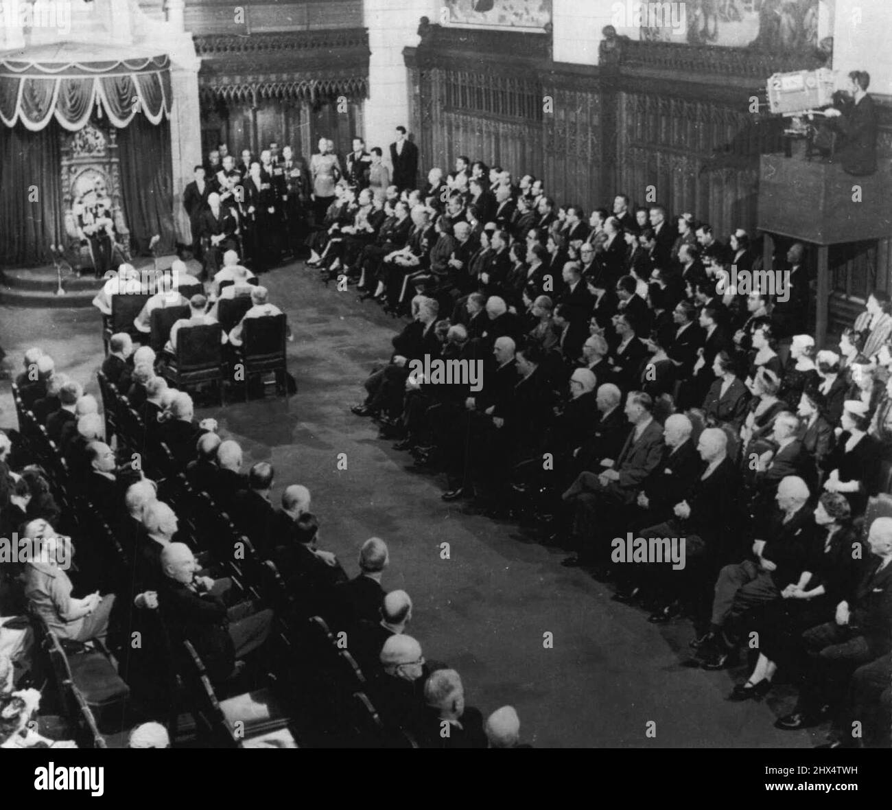 Historic Moment - A television camera on a specially-built stand in the senate chambers for the first time in history records the traditional opening of parliament. Governor-general Massey in seated reading the speech from the throne. January 7, 1955. (Photo by AP Wirephoto). Stock Photo