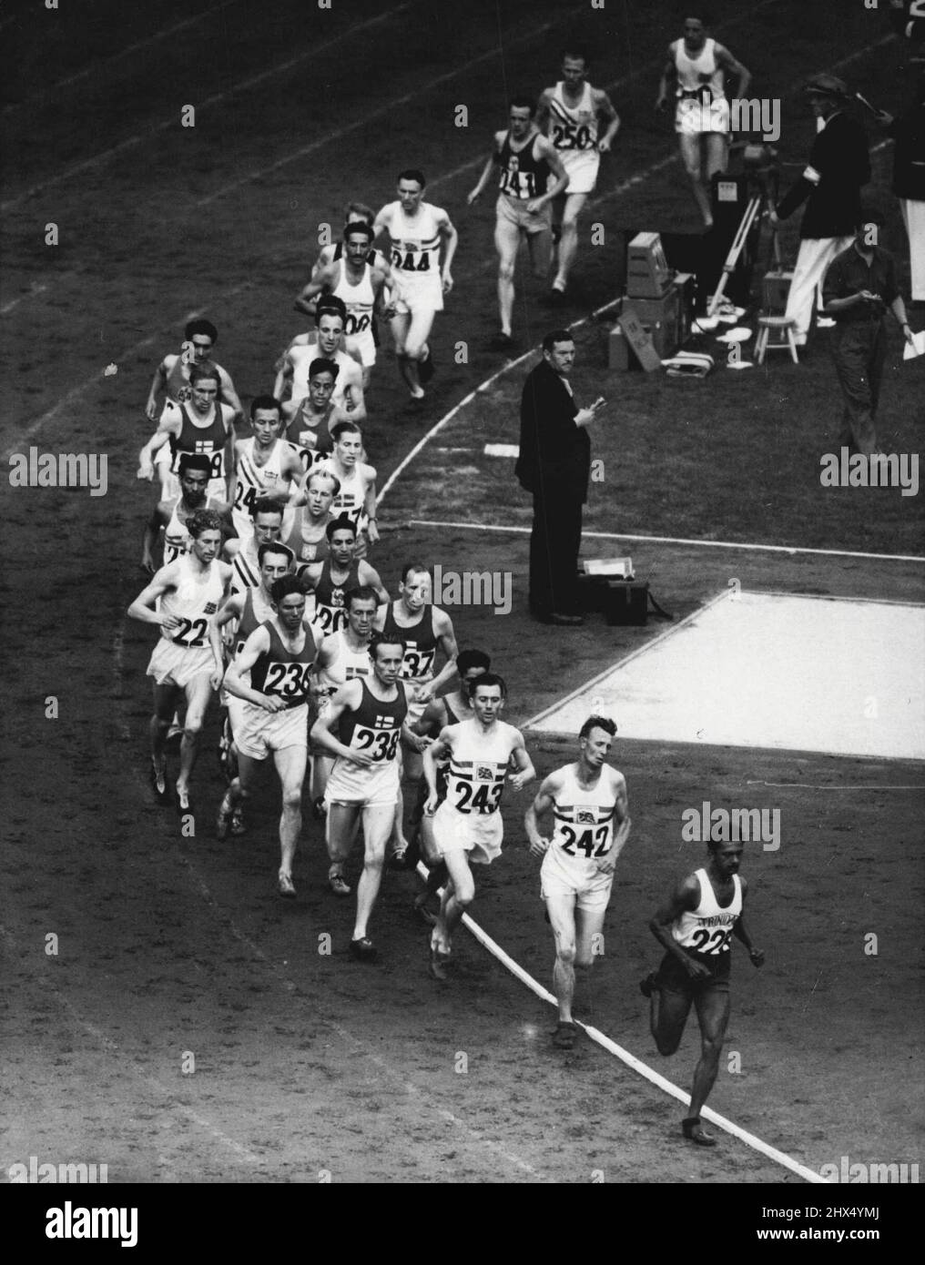 Olympic Games : Contestants in the 10,000 Metres rounding the bend at Wembley Stadium this afternoon (Friday). The event was won by E. Zatopek (CZech). Picture taken after 880 metres. July 30, 1948. (Photo by Reuterphoto). Stock Photo