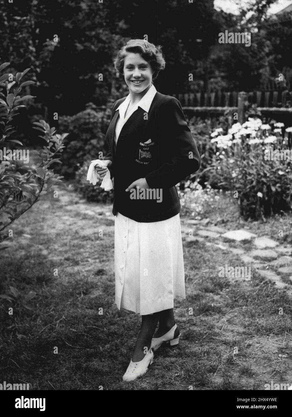 The Olympic uniform: Let the babies of the British Olympic Team, diver ***** of Liford, Essex, pictured this evening in ***** Olympic uniform which will be worn by all woman members at the Games in Helsinki. Tomorrow evening the team is being received by the Queen at Buckingham Palace. July 06, 1952. Stock Photo