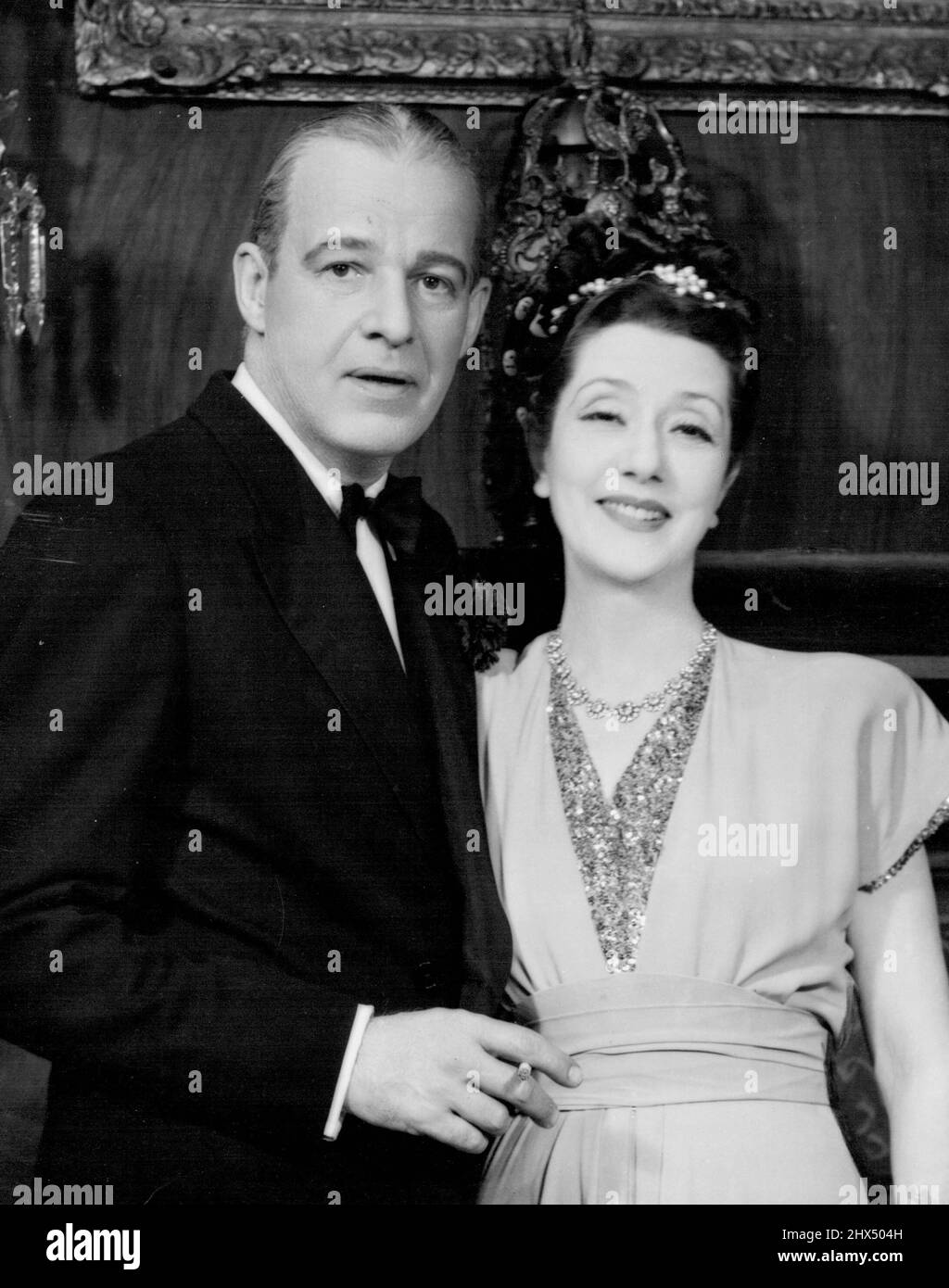 Alfred Lunt and Lynn Fontanne in the 1947 play, O, Mistress Mine. While appearing in it, they celebrated their silver wedding anniversary - an event out of step with Broadway tradition. October 08, 1952. (Photo by Vandamm Studio) Stock Photo