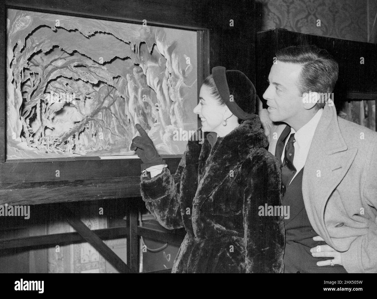 Ballet Exhibition For Spain And Portugal. Helpmann and Fonteyn At Private View. Sadlers Wells' ballet dancers Miss Margot Fonteyn and Robert Helpmann looking at a model of a scene from 'Giselle' when they attended a Private View of a British Council exhibition of British Ballet, which on April goes on show at Madrid, Barcelona, and probably Bilbao. Later in the year the exhibition will be seen in Lisbon. The exhibition includes scale models of stage sets, original costume and set designs and photographs, books on ballet, and musical scores. Helpmann and Fonteyn, who recently toured American Stock Photo