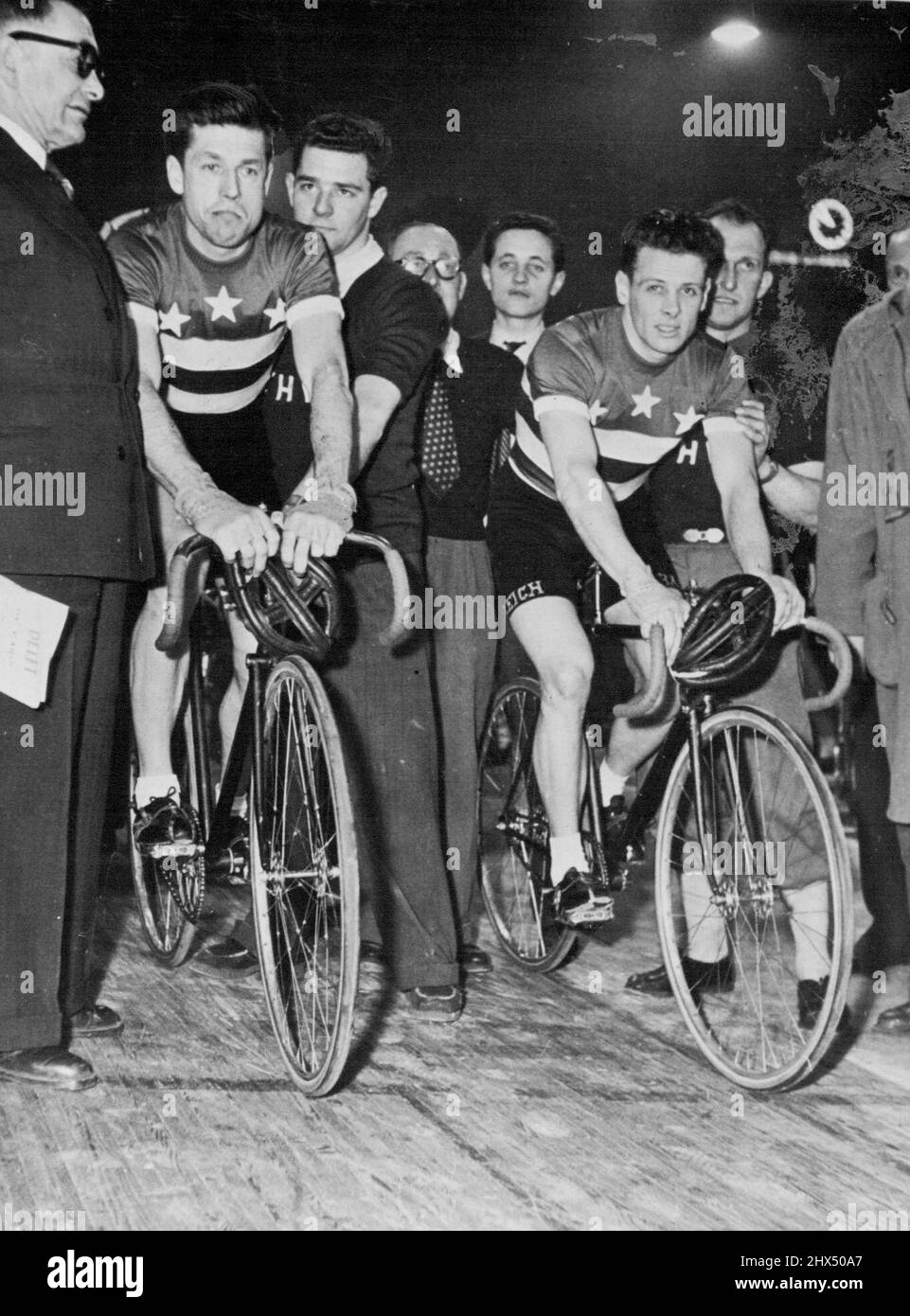 Crack Australian cycling pair, Alf Strom (left) and Roger Arnold, at the start of the recent six day's race in Paris. March 14, 1953. (Photo by Paul Popper Ltd.). Stock Photo