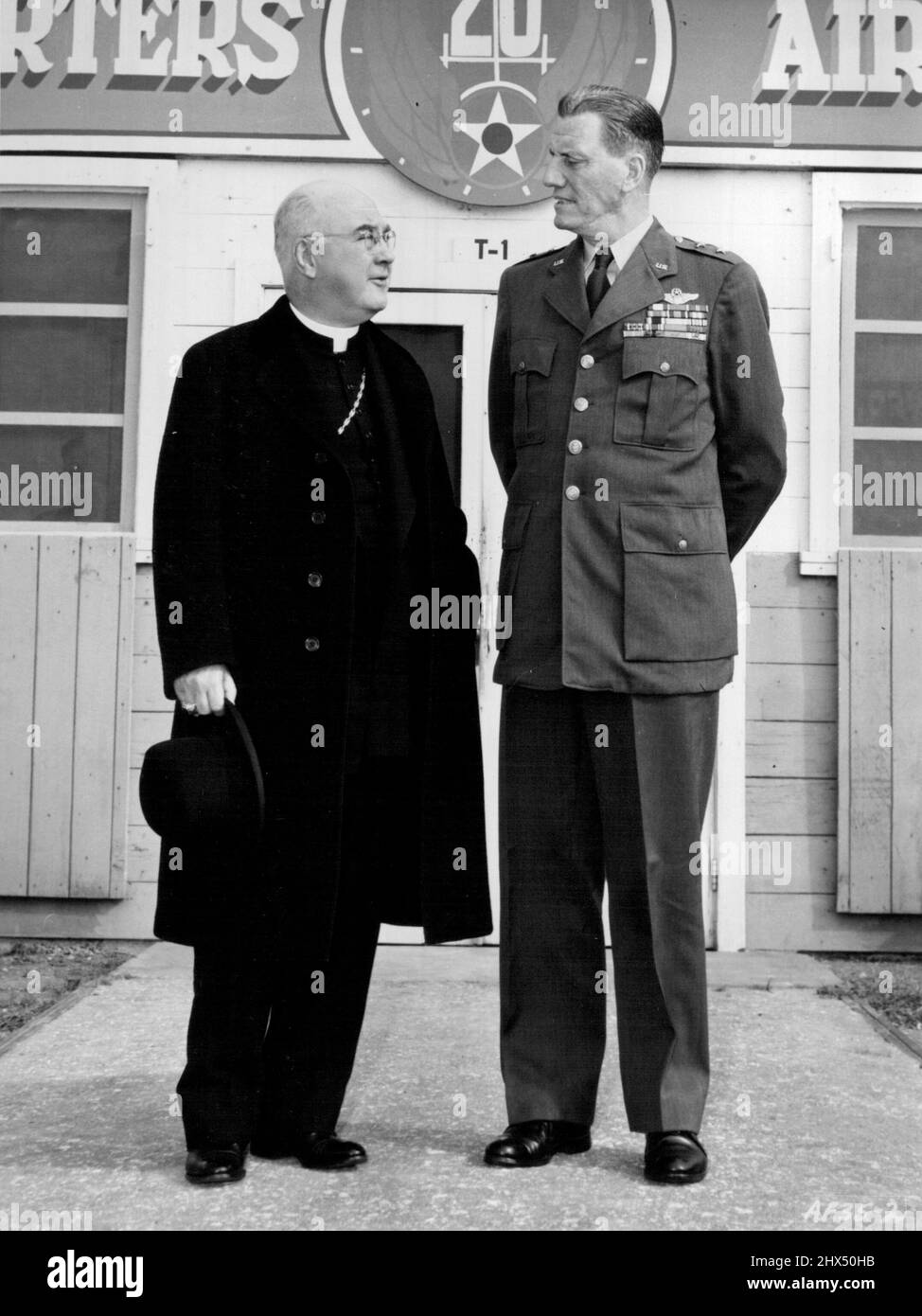 Varied Interests Discusses - Airpower and prayer power are the topics of conversation as his Eminence Francis Cardinal Spellman confers with Maj. Gen. Ralph F. Stearley outside the Okinawa headquarters of the Twentieth Air Force. Military vicar for the armed forces, Cardinal Spellman spent a day talking with combat personnel throughout the island. January 07, 1952. (Photo by USAF Photo). Stock Photo