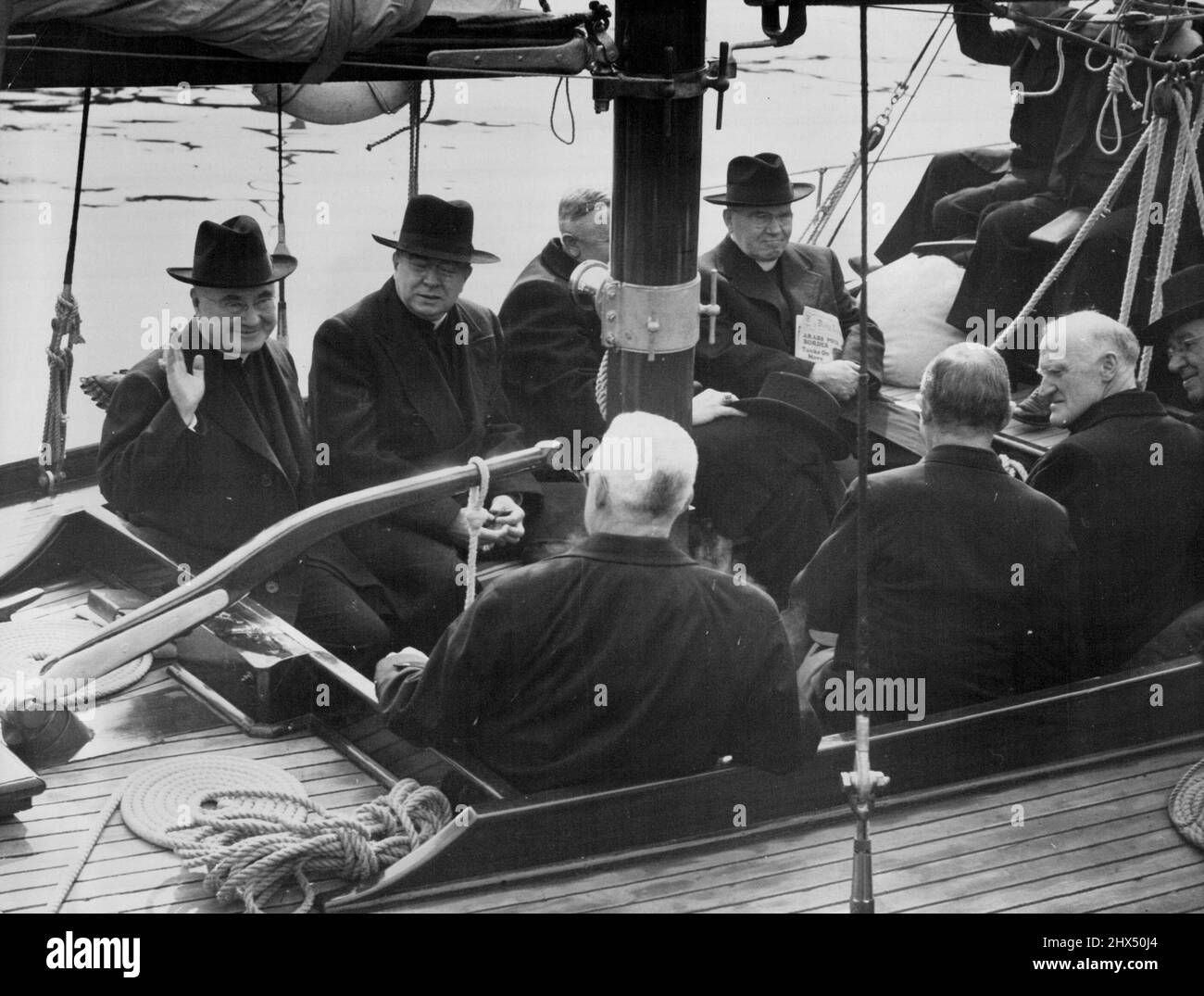 At left is Cardinal Spellman and other Catholic dignitaries, leaving Man-o-War Steps for a tour of the harbour on board Mr. Phil Goldstein's ketch Archina. April 29, 1948. (Photo by Frank Albert Charles Burke/Fairfax Media). Stock Photo