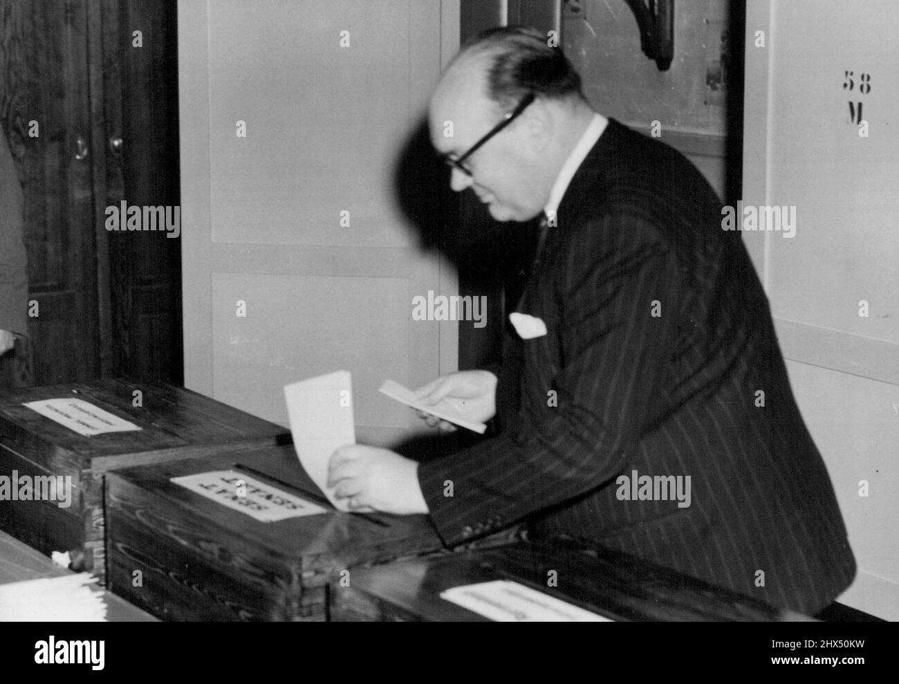 The Belgian Elections M. Spaak Records His Vote -- M. Paul-Henri Spaak, the Belgian Foreign Minister, as he records his vote during the elections.The fate and future of a King in the hands of the people of Belgium as they go to the pills to-day (Sunday).The main issue of the elections is the fight between the Christian-Social (Catholic) Party, and the socialists. The Liberals are siding with the Catholics for the return of exiled King Leopold III, and if these parties are returned with a sufficient majority, the question of the King's return will be put to a National reference *****.The Cathol Stock Photo