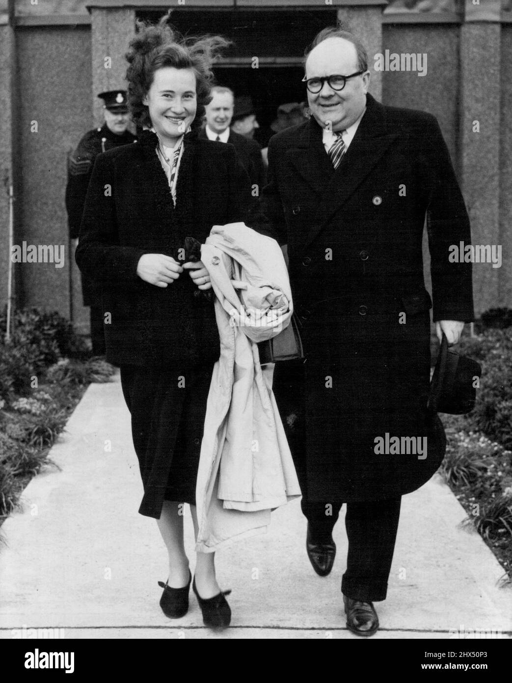 The Prime Minister Drops In -- Fleeting visitor to London to-day (Thursday) was Belgian Prime Minister Paul-Henri Spaak, who arrived at London Airport by Pan American Clipper on his way home to Brussels from the United States. He is seen here at London Airport with his daughter, Mrs. Marie Palliser (wife of an Englishman) before he left again for Brussels. M. Spaak signed the North Atlantic Treaty in Washington on behalf of Belgium.  April 07, 1949. (Photo by Pictorial Department) Stock Photo