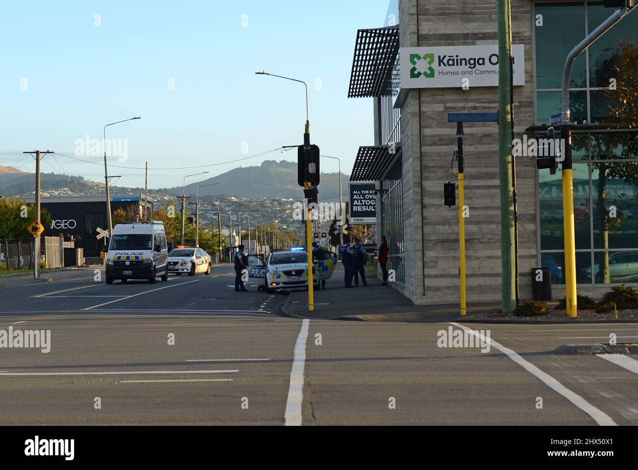Christchurch, New Zealand, March 1, 2021: Police attend to their business in Christchurch city. A member of the public has their face pixelated while being questioned. Number plataes are pixelated. Stock Photo