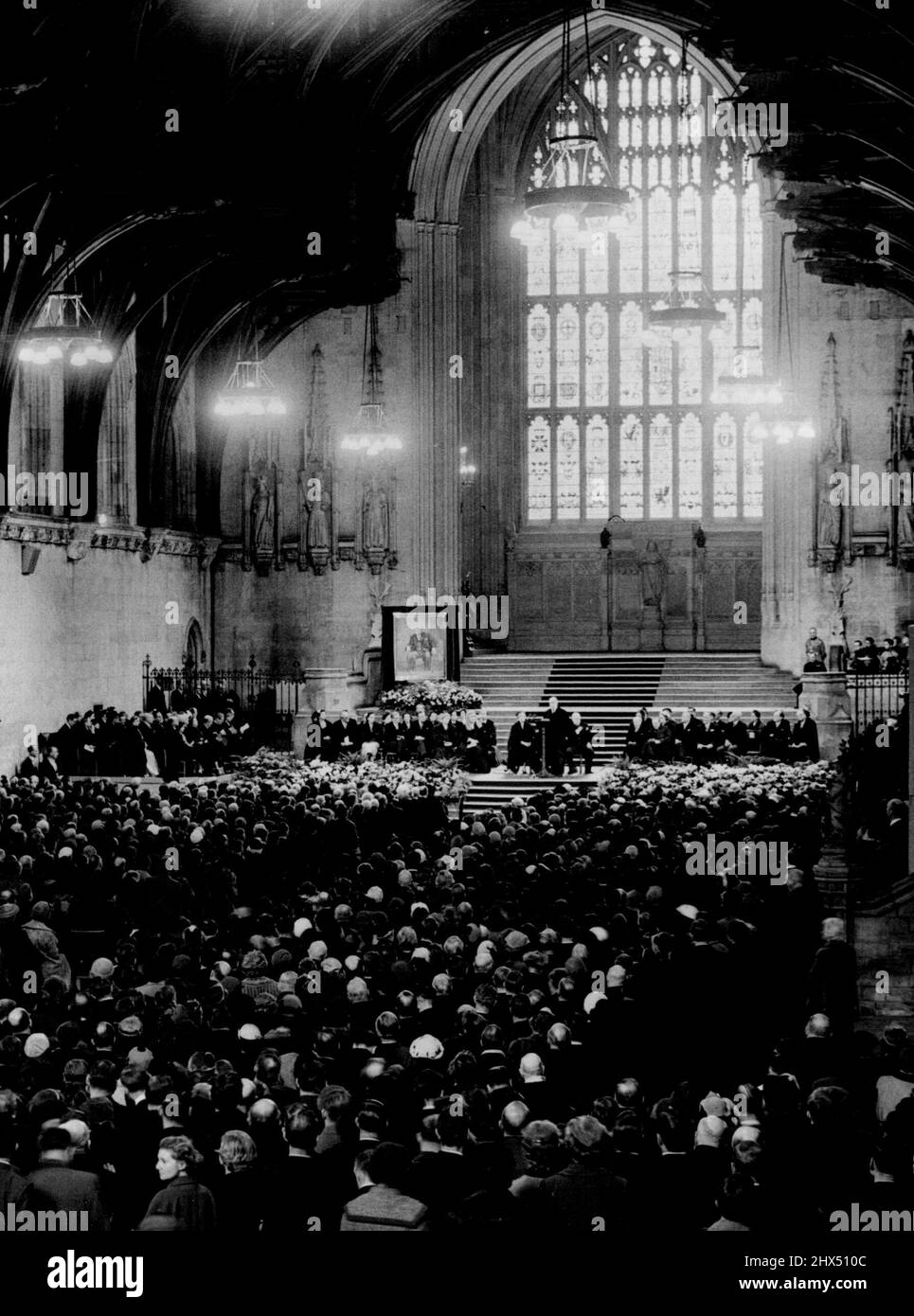 Parliament's Presentation -- The scene in Westminster hall during the presentation ceremony.... on the platform can be seen the portrait of Sir Winston.Members of both houses of Parliament gathered in Westminster today to witness the presentation of Parliament's birthday gifts to Sir Winston Churchill.Mr. Attlee, leader of the opposition presented to a portrait in oils by Graham Sutherland.. a joint gift of both houses.Mr. D.R. Grenfell, M.P. father of the house of commons (senior member) presented a beautiful illuminated book which had been signed by nearly at the M.P.'s. November 30, 1954. ( Stock Photo