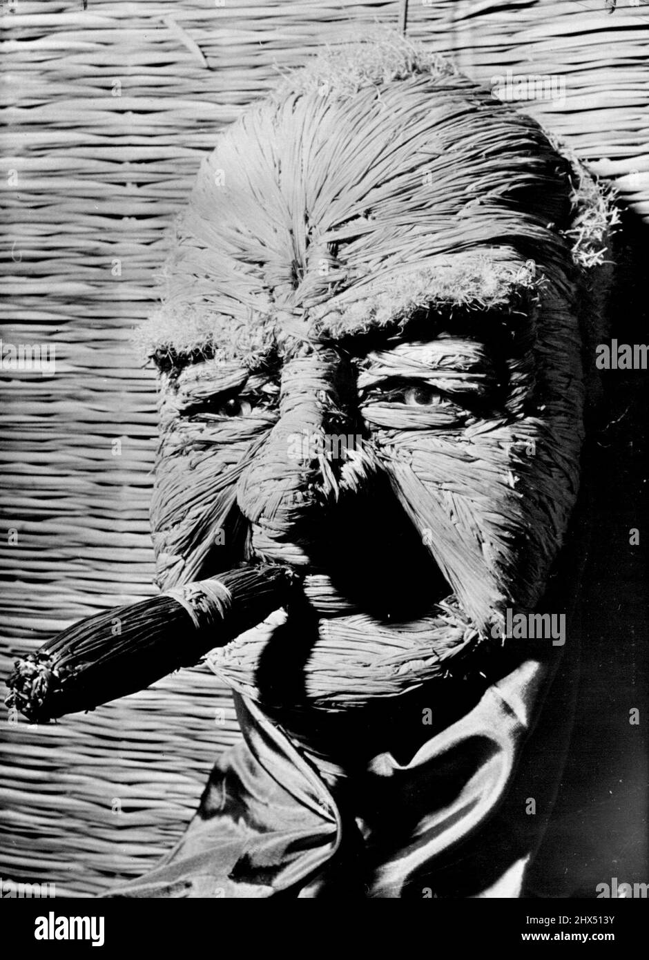 Sculpture in Straw -- Mr. Churchill though he could hardly be called a man of straw. The Italian sculptor V.N. Luri has developed a new medium. The World's personalities find themselves executed in straw. March 12, 1953. (Photo by Paul Popper). Stock Photo