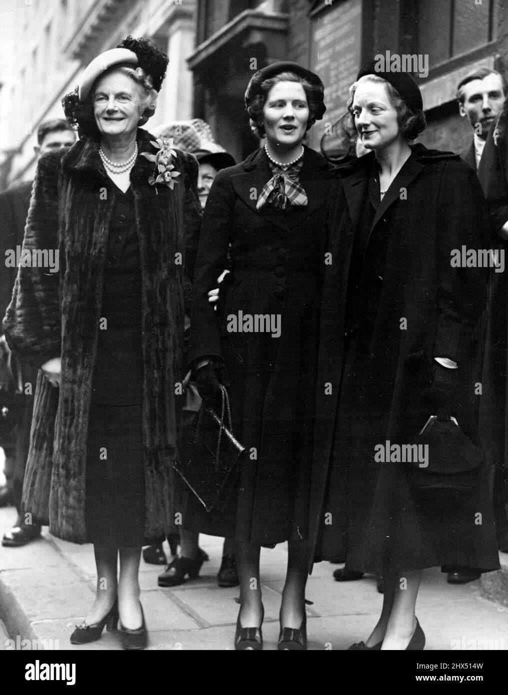 Nephew of Mr. Churchill WedsMrs. Churchill (left), with her daughters, Mary and Sarah (right) when they attended the welding this afternoon (Fri).Mr. Giles Romilly, a nephew of Mr. Winston Churchill, was married to miss marry Ball-Dodd eldest daughter of a York doctor, at the church of our lady, Warwick street, London today (Friday) Mr. Romilly was serving a war correspondent when he was arrested by the Germans when they entered Narvik in April, 1940. He was interned with other prisoners who were relatives of British war leader Keitel, former Chief of the German High command called hik to give Stock Photo