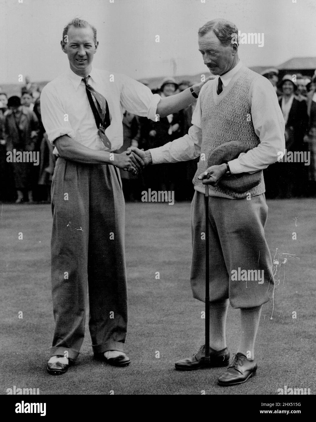 Hon. Michael Scott's Great Triumph in Amateur Golf Final - The Hon Michael Scott on right shaking hands with Dale Bourn on the 16th Green. The Hon Michael Scott won the amateur Golf final at Hoylake yesterday June 24 beating Dale Bourn by 4 and 3. Scott is 55 and one of the oldest Tournament winners in Golf History. June 25, 1933. (Photo by The Associated Press). Stock Photo