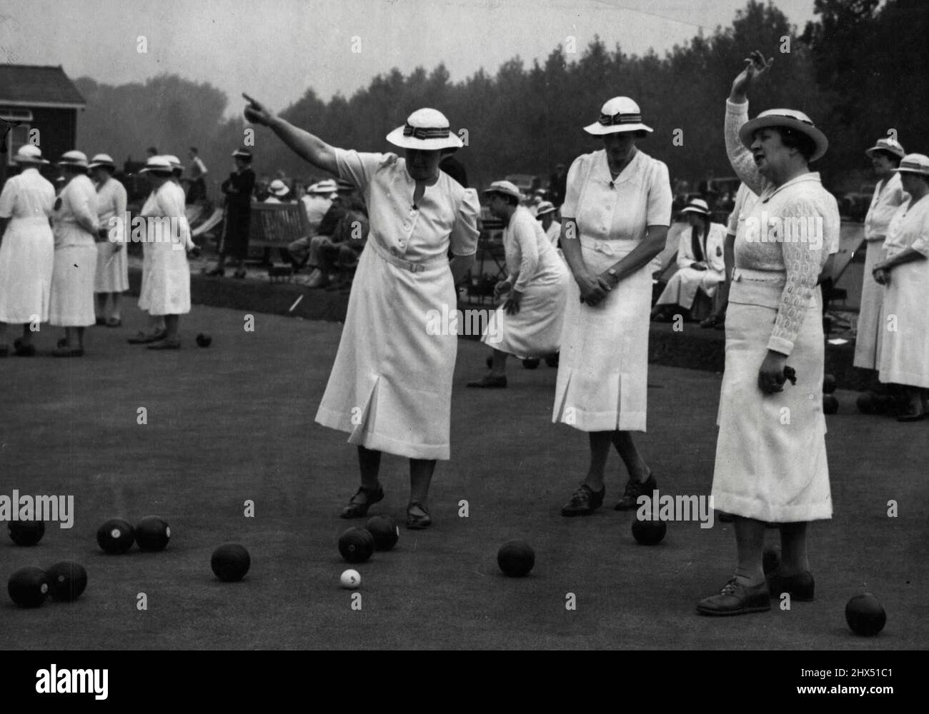 Woman's Bowling Championships -- Signaling a good wood, during the match between Suffolk and Surrey. The English women's bowling association's amateur national championships were begun this morning at Wimbledon park bowling greens. August 21, 1939. (Photo by Keystone). Stock Photo