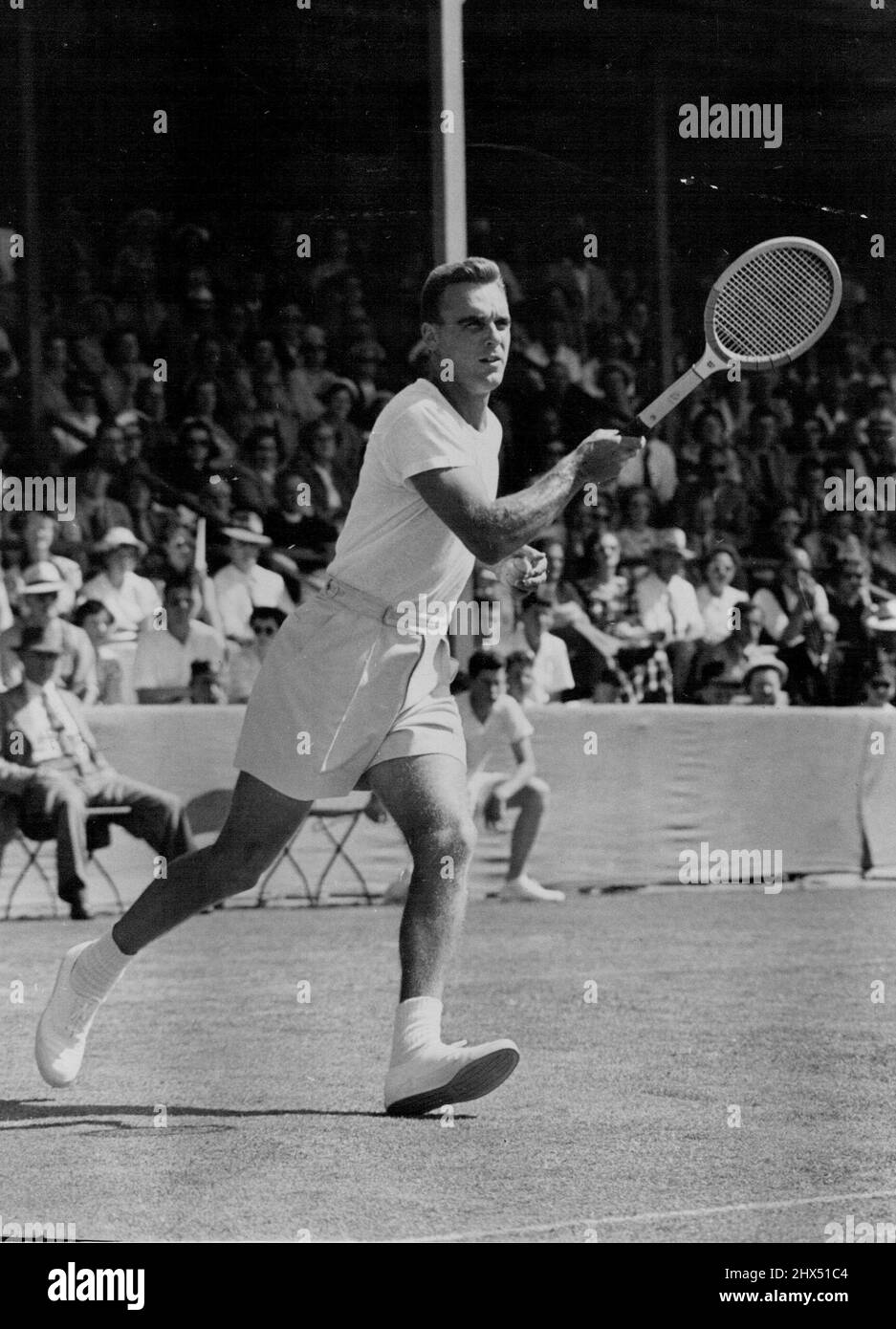 E. V. Seixas (United States Davis Cup team) at the end of a powerful forehand drive in his match against G.A. Worthington, of Auckland, former Australian Davis Cup player. In an exhibition match each player won one set. January 01, 1952. (Photo by N.Z. Herald). Stock Photo