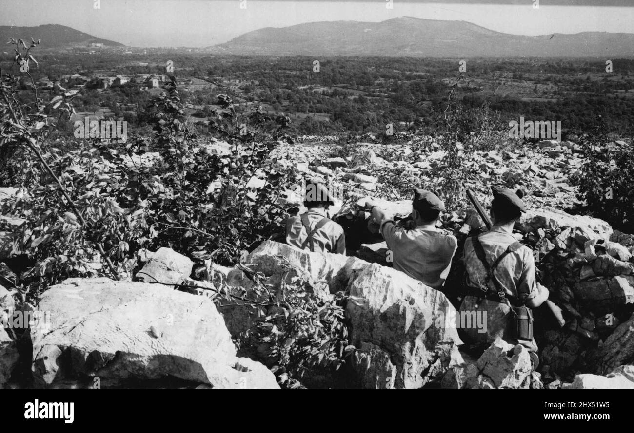 Policing Trieste: 'Operation Betfor' - Officer and the men of the Royal Scots Regiment, at an observation point, keep close match on Yugoslav troop movement in the village of Orle, East of the 'French Line' and Trieste. Until the Governor of Trieste - who has yet to be appointed - Decrees otherwise, the new free territory of Trieste, is being policed by a force of some 10,000 British and American Troops. October 30, 1947. (Photo by Associated Press Photo). Stock Photo