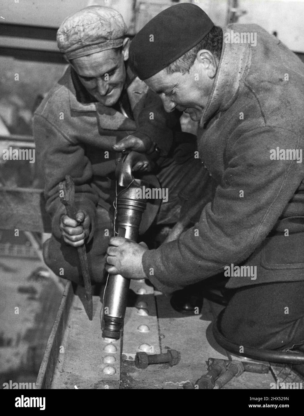 Riveters Heavy clothing is worn by Clem Broomfield (iron worker