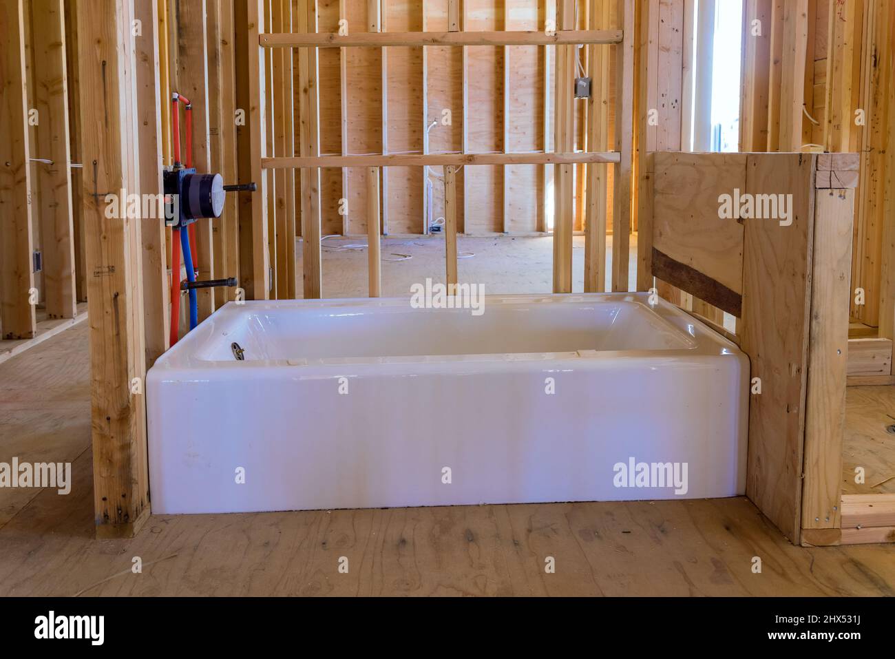 A under construction new building with Installed new acrylic bathtub