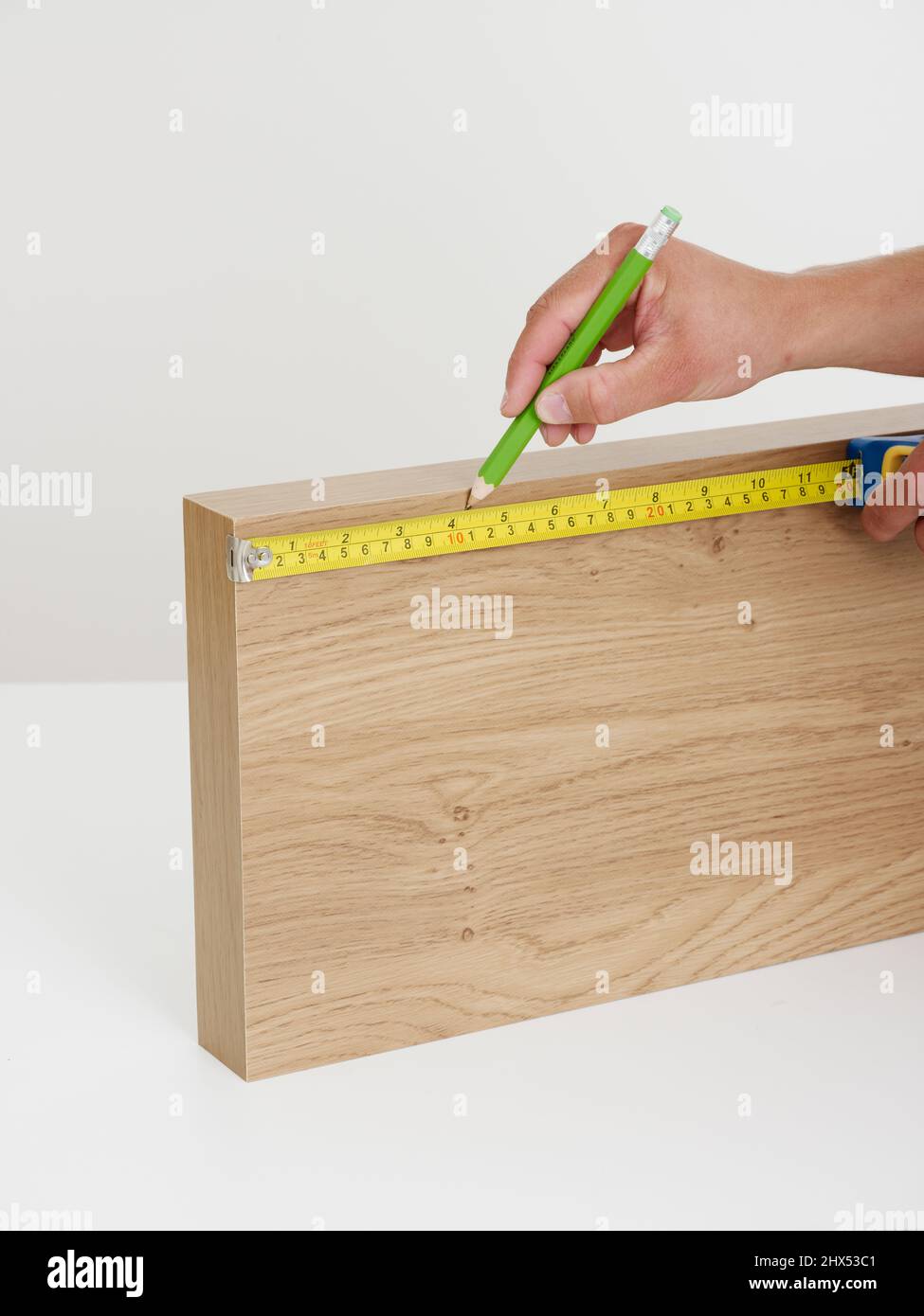 Fitting wall shelves, attaching the brackets, making pencil marks for