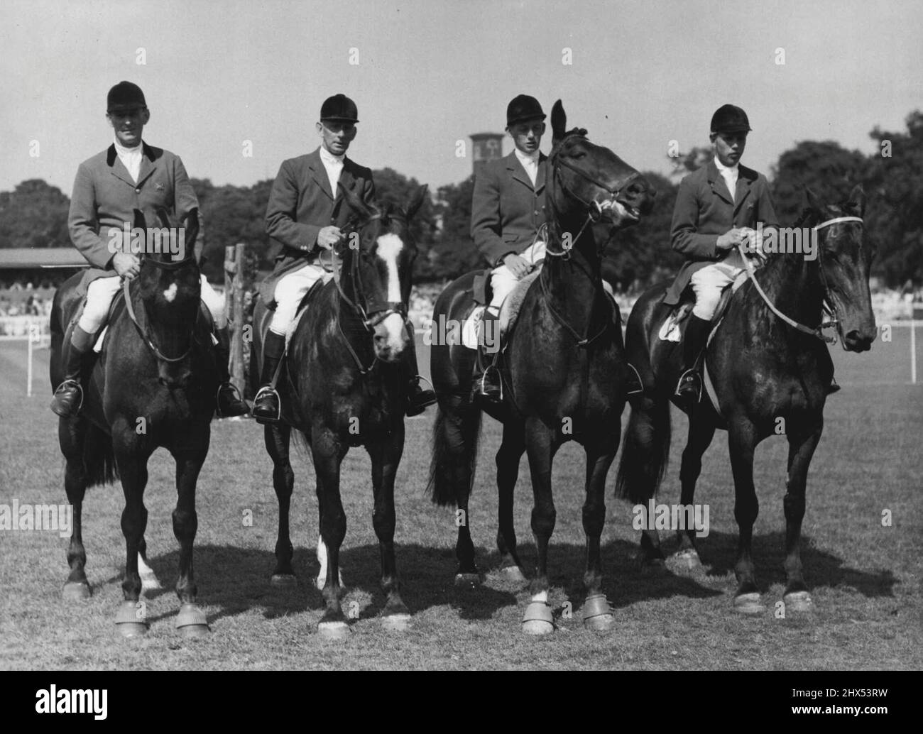 Olympic Riders at Richmond Royal Horse Show - Some of the Olympic Riding team photographed at Old Deer park Richmond today. They are, left to right: Colonel H. Llewellyn on Monarch; W. White on Nizefella; Allan Oliver (Youngest member of the team) on Aherlow; and Peter Robeson on Craven A. More entries than ever before are taking part in the Richmond Royal Horse Show which opened today at Old Deer Park, Highlight of the day was the appearance of members of the Olympic riding team, HM the Queen will attend the show on Saturday. June 12, 1952. (Photo by Fox Photos). Stock Photo