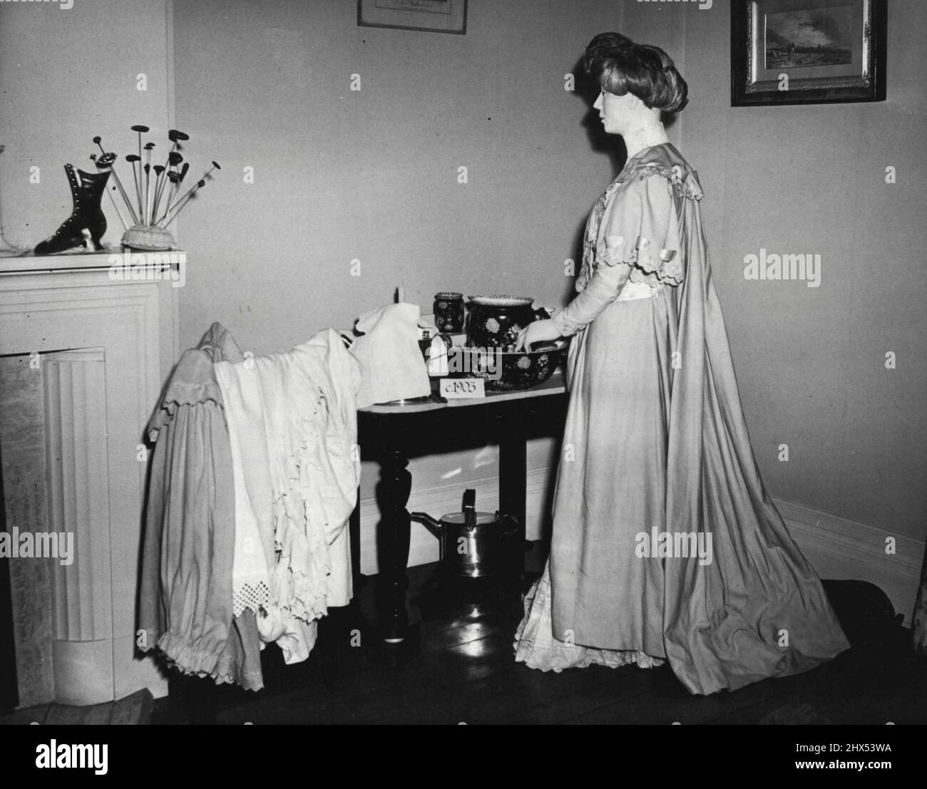 Dressing gown by washstand. The Museum of Costume at Eridge Castle, Kent. June 01, 1955. (Photo by Fox Photos). Stock Photo