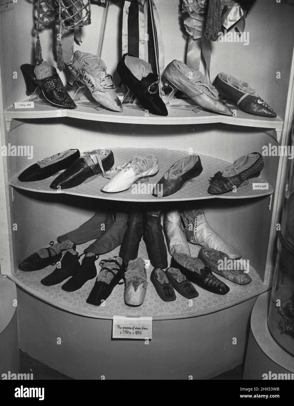 Case showing progress of chose 1750 to 1850. The Museum of Costume at Eridge Castle, Kent. June 01, 1955. (Photo by Fox Photos). Stock Photo