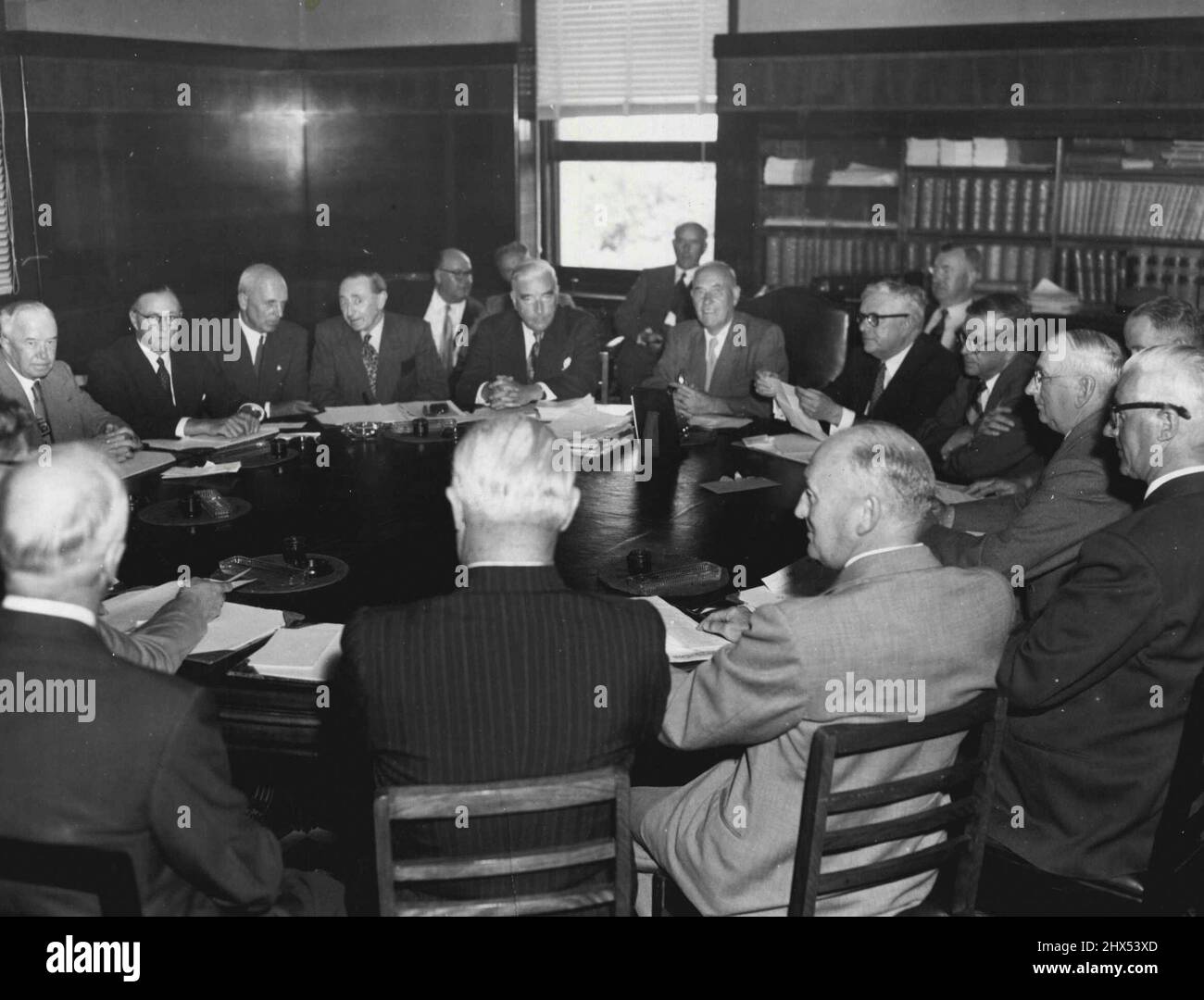 The Fate of the Olympic Games Site rested in the hands of these men today. From left to right Sir Herbert Hyland; Victorian Opposition leader, Mr Oldham; Mr H. C. Newman, Commonwealth representative in the Olympic Council; Mr E. Tanner; the deputy Premier, Mr Galvin (background); the Prime Minister, Mr Menzies; the Premier, Mr Cain; Dr. Evatt, Federal Opposition leader; Mr Coleman, Minister for Transport; Mr Barry, Minister for Health; Mr Ken Luke, president of Carlton Football Club, and Mr A. W. Coles, chairman. January 30, 1953. Stock Photo