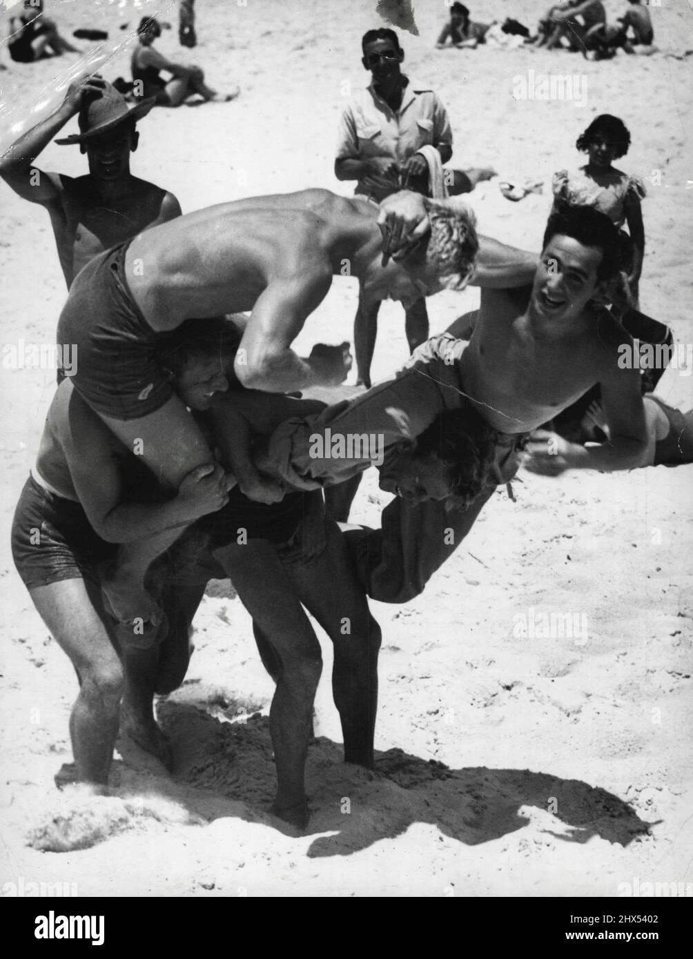 Horseplay. North Bondi Surf Club members show the kind of horseplay they detest. The actors include. Colin Guthrie, Kevin McGuire, Ron. Lennon, Tom Edwards and Frank Taylor. December 26, 1948. Stock Photo