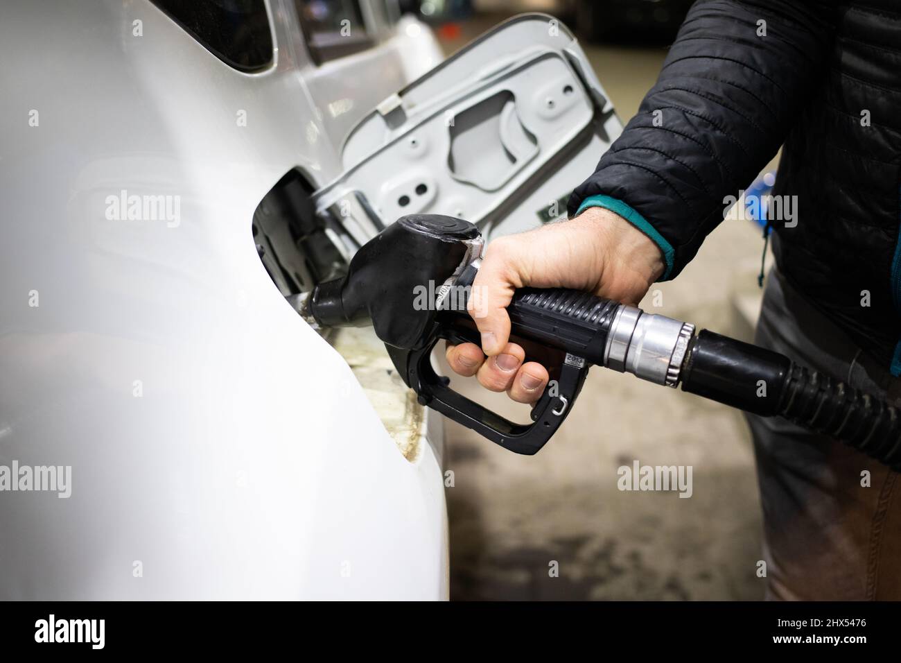 gas station putting gasoline into car oil price Stock Photo Alamy
