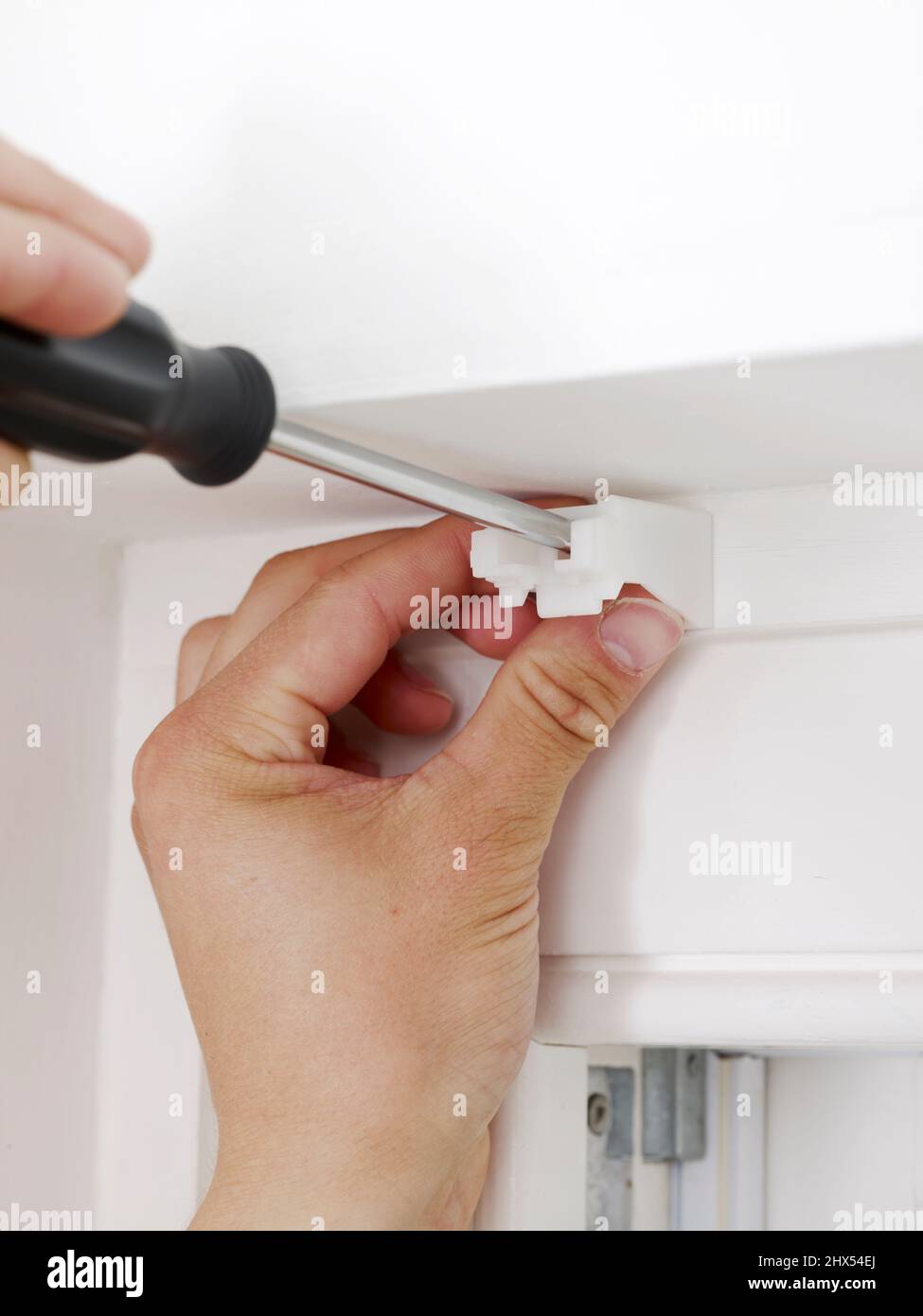 Hanging a Roman blind, fixing the brackets, screwing the brackets to