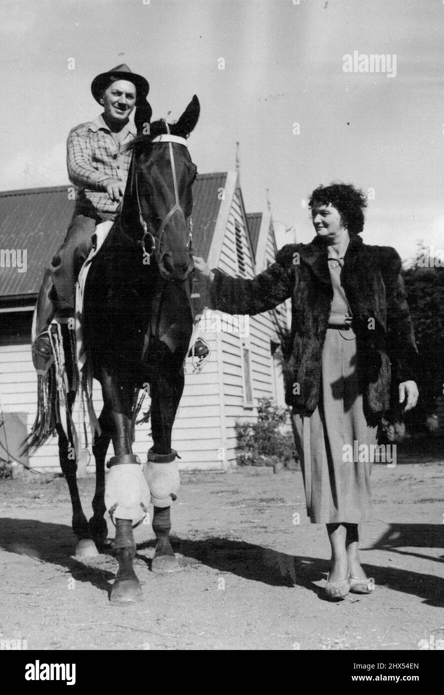 Following his unlucky fourth in last Saturday's Oakleigh Plate, San Domenico is at the top of his form for tomorrow's Futurity Stakes at Caulfield. He is shown returning from the track, carrying his trainer. Bill Kearns. March 07, 1952. Stock Photo