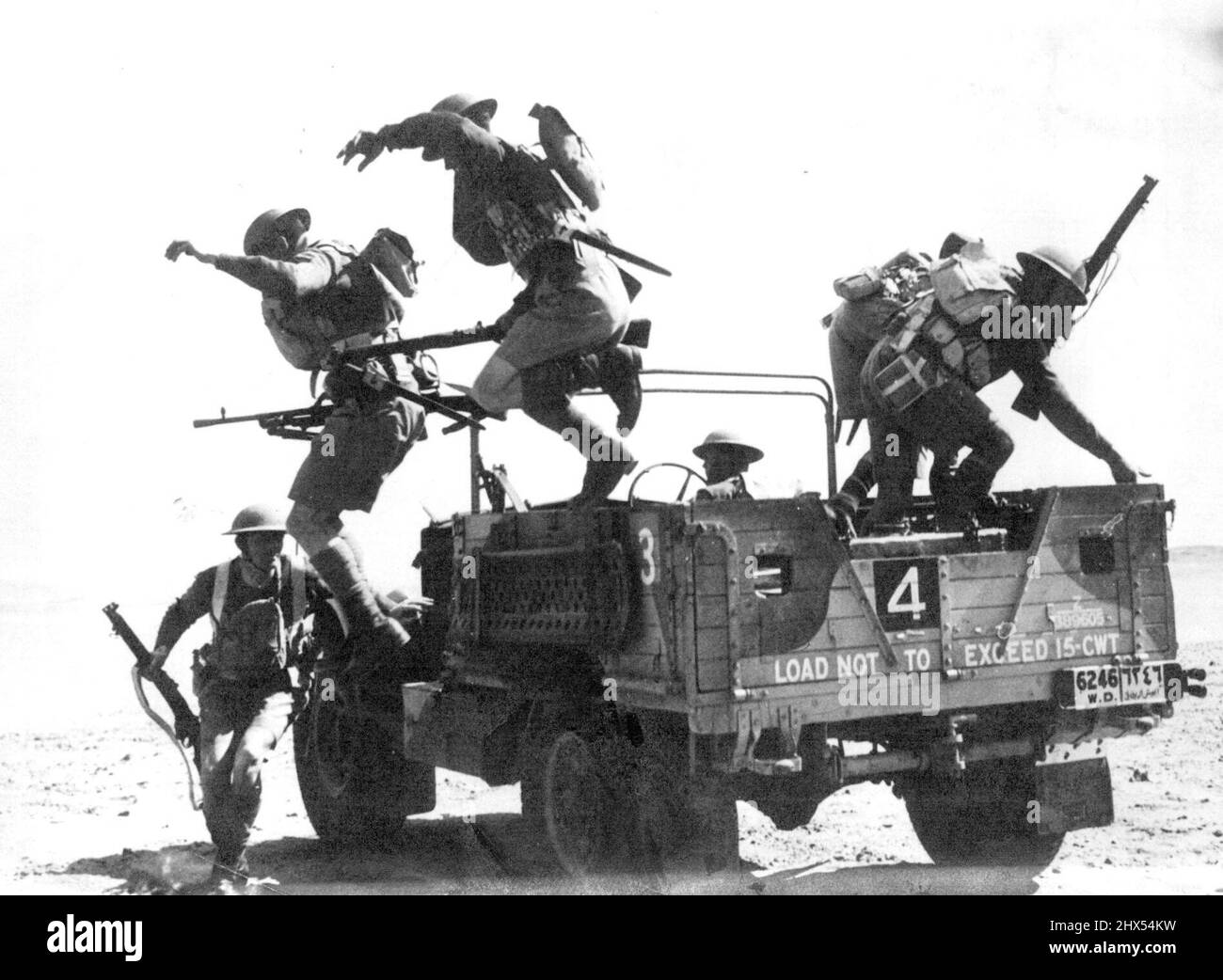 Allied Troops Keep Watch Over The Gateway To The East. British Troops on wartime manufuyres in Egypt. Men of A British armored division leaping to it in the course of energetic exercises in the desert. The Great Allied empires of Britain and France hold the western front but they near their Lyes on the middle east. They ***** fully historic passes to the East which ***** in the keeping of the British general wavell and the French General Weygand. Heri as everywhere the British and French are working in close Co-operation. April 22, 1940. Stock Photo