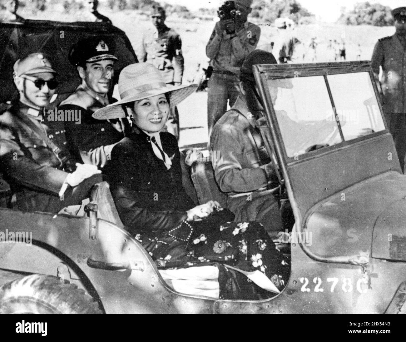 Generalissimo Chiang Kai-Shek Inspects Training Centre For Chinese Soldiers In India -- Generalissimo Chiang Kai-shek takes his place at the side of Admiral Lord Louis Mountbatten, Supreme Allied Commander, South-East Asia, while Mme. Chiang Kai-shek sits beside the Jeep driver, during a tour of training centres in Eastern India, where Chinese soldiers are under the instruction of U.S. Army officers.Following the Cairo Conference Generalissimo Chiang Kai-Shek and Mme. Chiang Kai-Shek stopped in India on the return journey to China, and visited a number of training centres where Chinese soldier Stock Photo