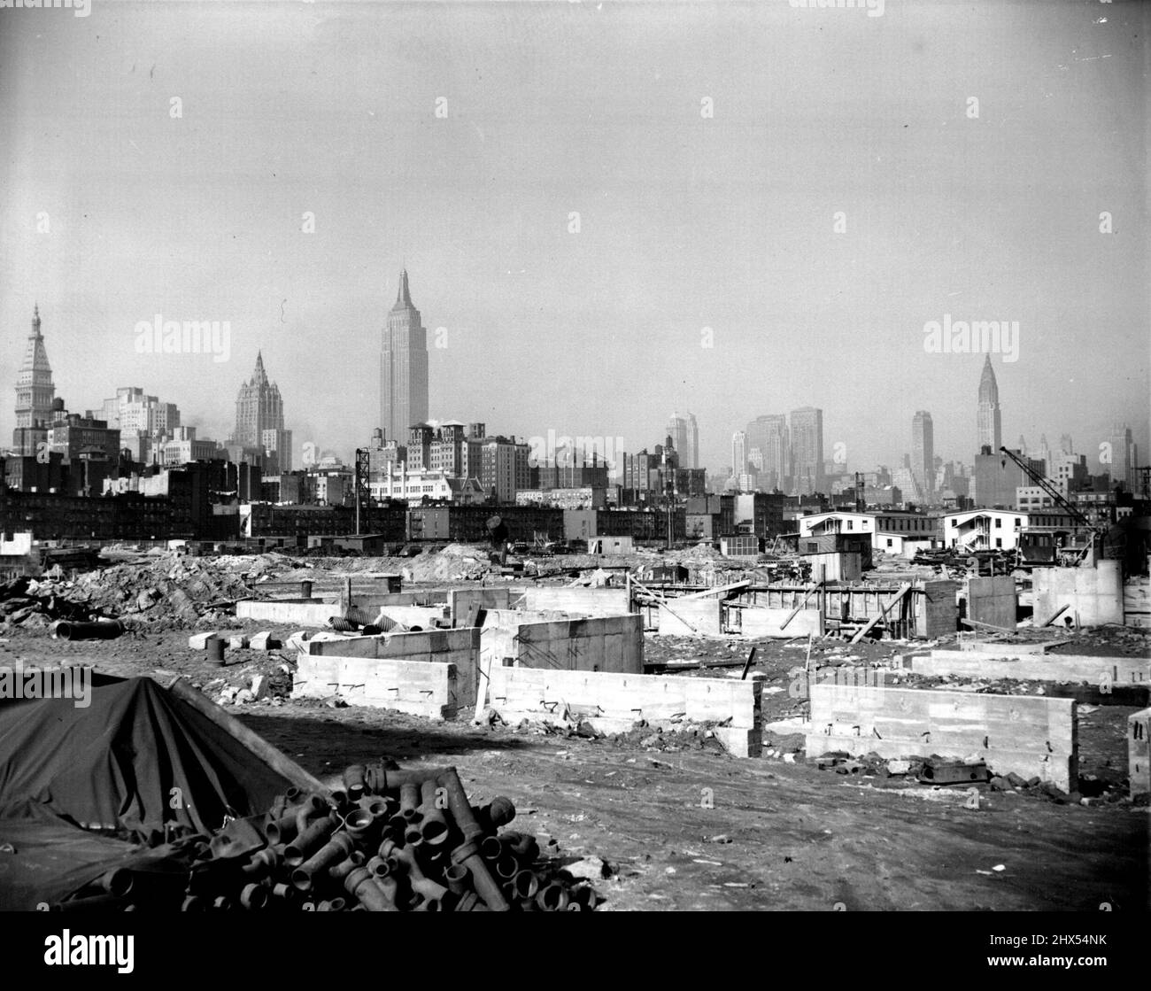 ***** center in the foreground, is the Empire state building. The tall, needle shaped structure at right is the Chrysler Building. April 2, 1947. (Photo by Wide World Photo). Stock Photo