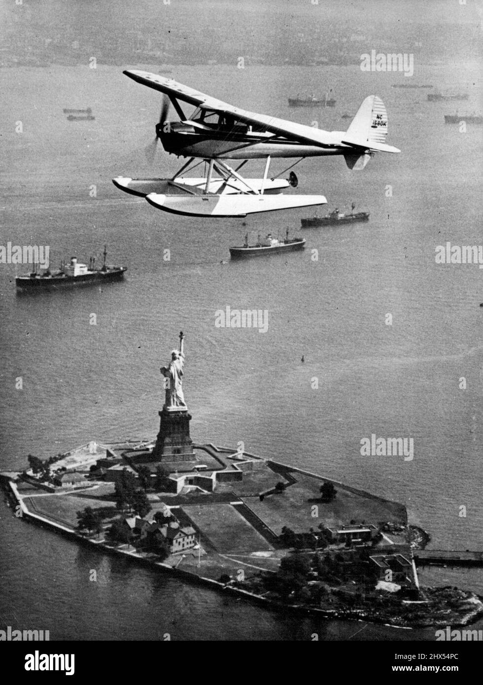 Statue Of Liberty In New York Harbour Aerial view shows seaplane