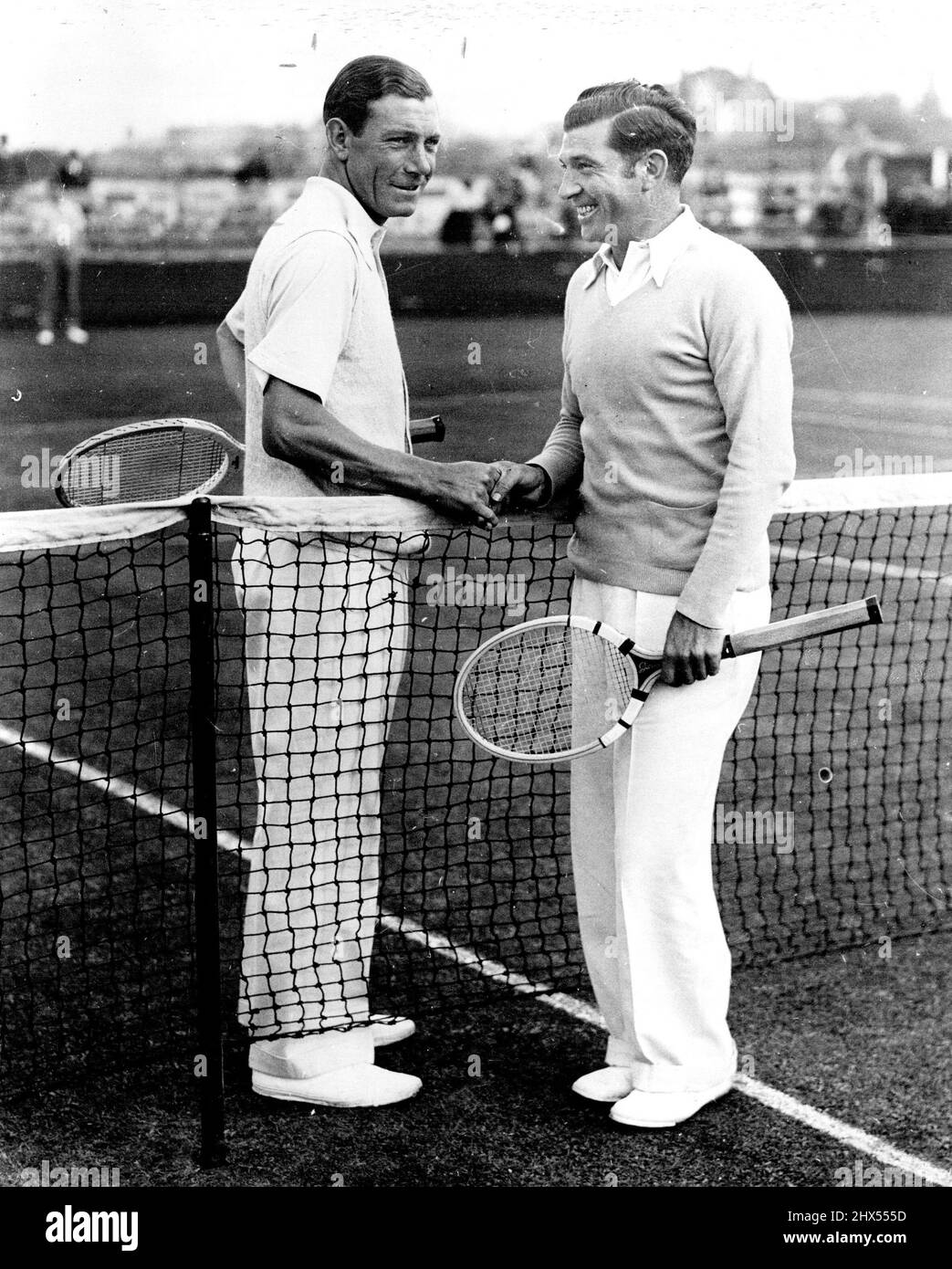 Southport Stages First All-Professional Tennis Tournament Dan Maskell the Wimbledon professional (left) and Martin Plaa (France) who played in the first match of the tournament yesterday. A new departure in first class tennis was seen at Southport yesterday when a three-day international tournament in the North. September 28, 1934. Stock Photo