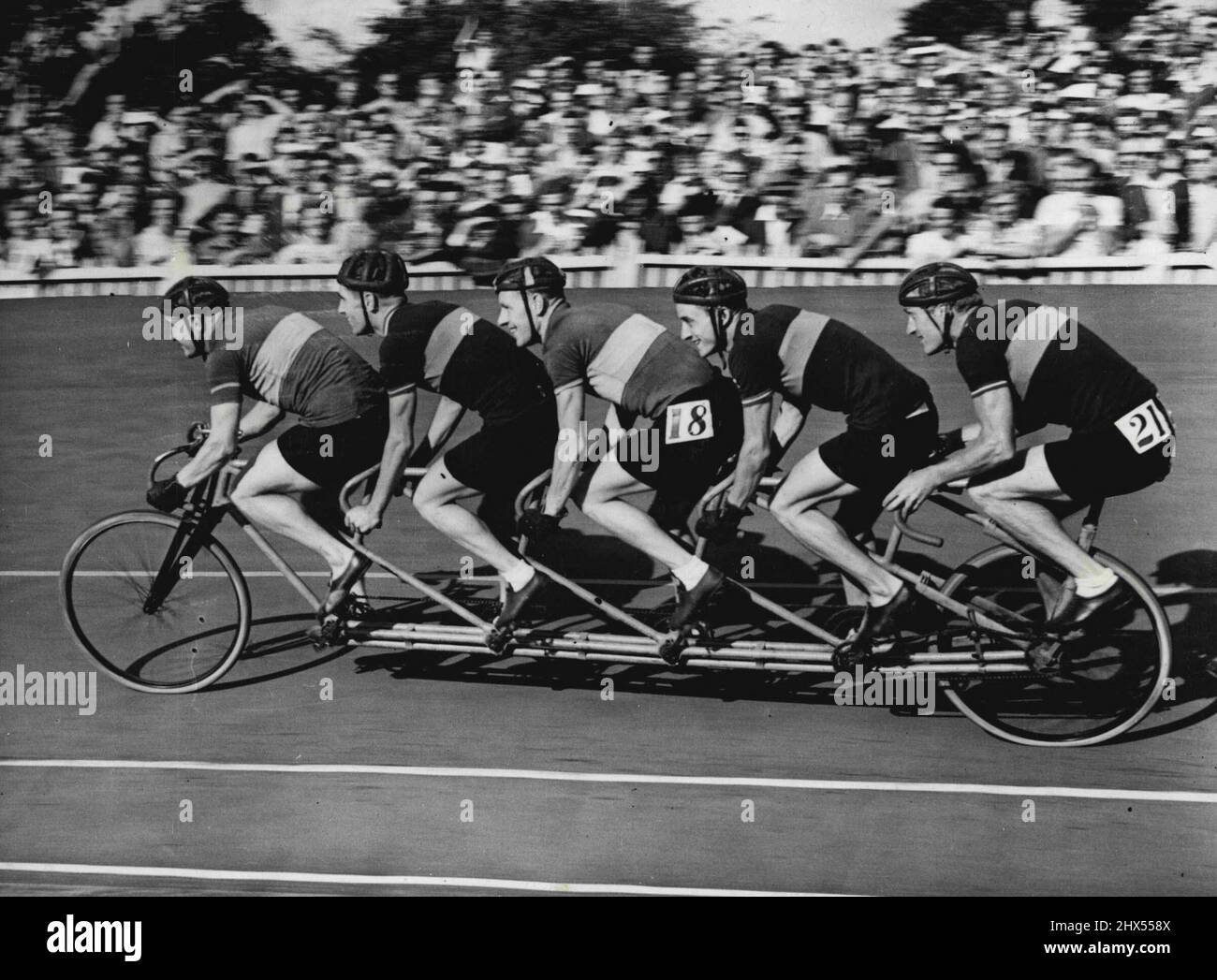 Cycling England V. France At Herene Hill The Dunlop Quintuplet Pacing Machine in action. The 'Quint' or five seater cycle was actually built about 50 years ago, but remained almost unused. It will be utilized for pacing purposes and demonstrations. September 22, 1949. (Photo by Sports & General Press Agency, Limited.). Stock Photo