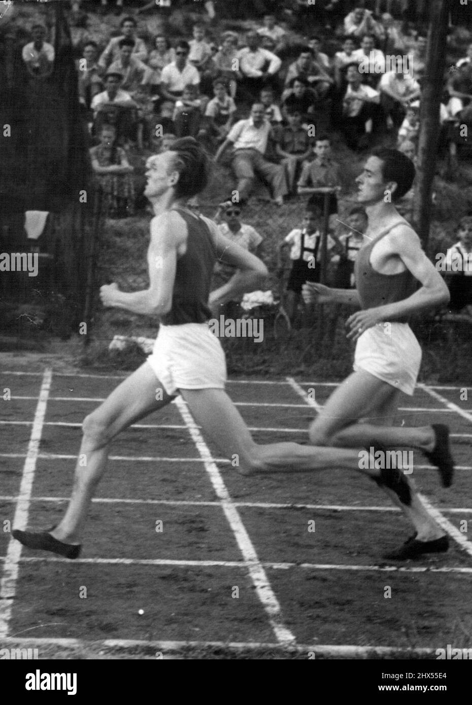 Istvan Rozsavolgyi and Sandor Tharos in action during a 1,500 metres race. November 26, 1955. (Photo by Magyar Foto). Stock Photo