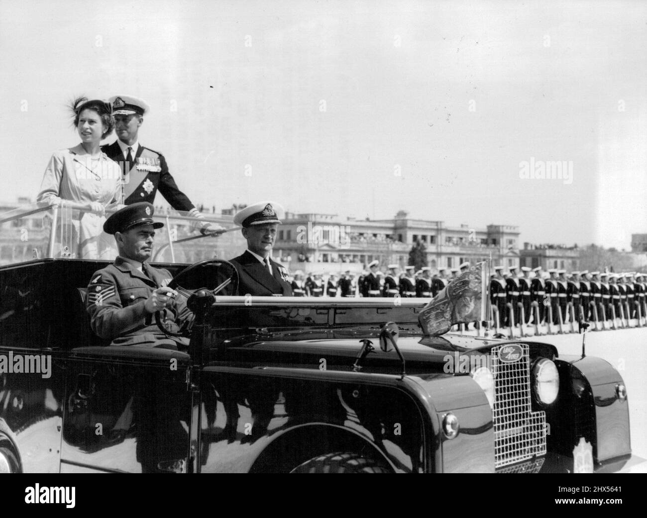 Queen reviews Combined Services Parade In Malta -- The Queen and Duke of Edinburgh inspect the parade from a land rover. H.M. the Queen and Duke of Edinburgh reviewed a combined services parade at Florianna, Malta, yesterday. Prince Charles and Princess Anne came ashore from the royal yacht Britannia to watch the parade from a hotel balcony. May 5, 1954. (Photo by Paul Popper, Paul Popper Ltd.). Stock Photo