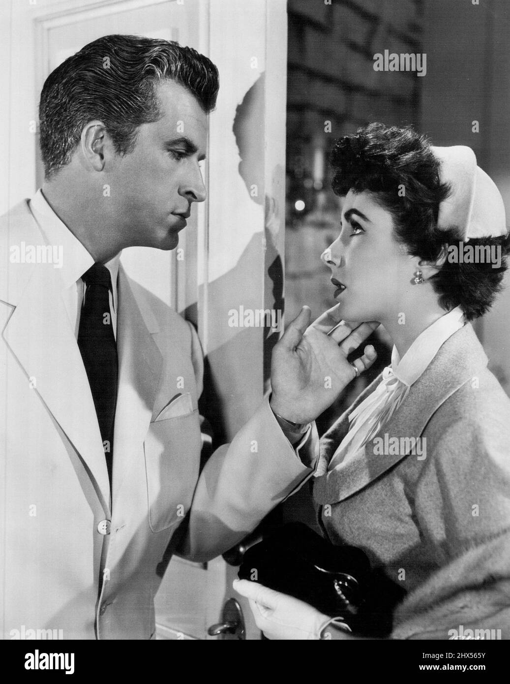 A Team Who Have Everything.. Gorgeous Elizabeth Taylor and handsome Fernando Lamas, currently starring in M-G-M's vivid drama, 'The Girl Who Had Everything'. William Powell also stars. January 01, 1953. Stock Photo
