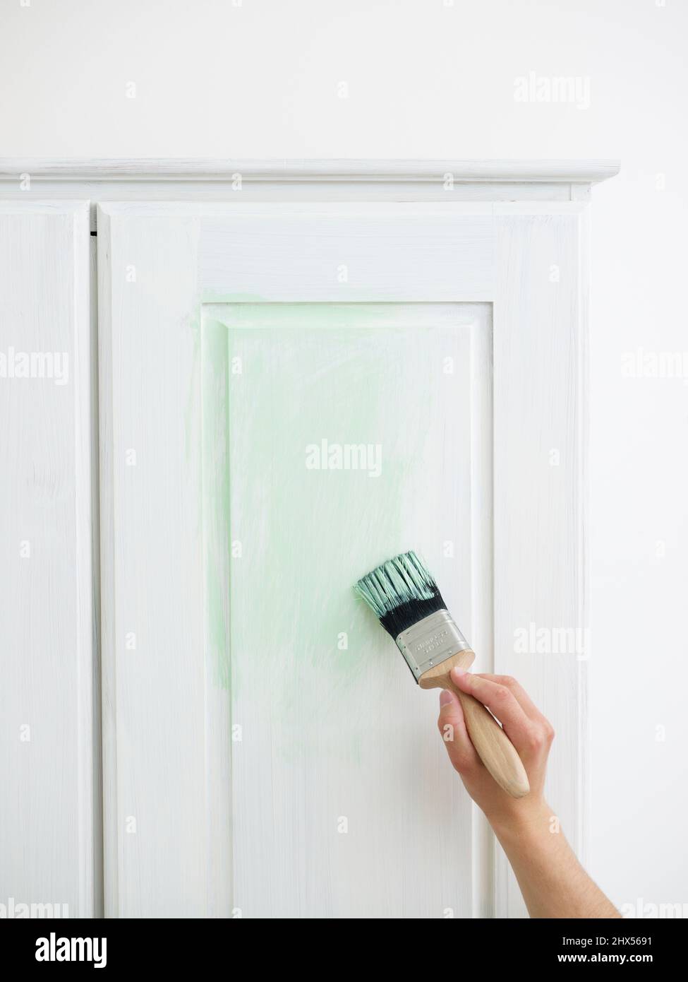 Revamping an old wardrobe, giving it an aged, antique look, applying an