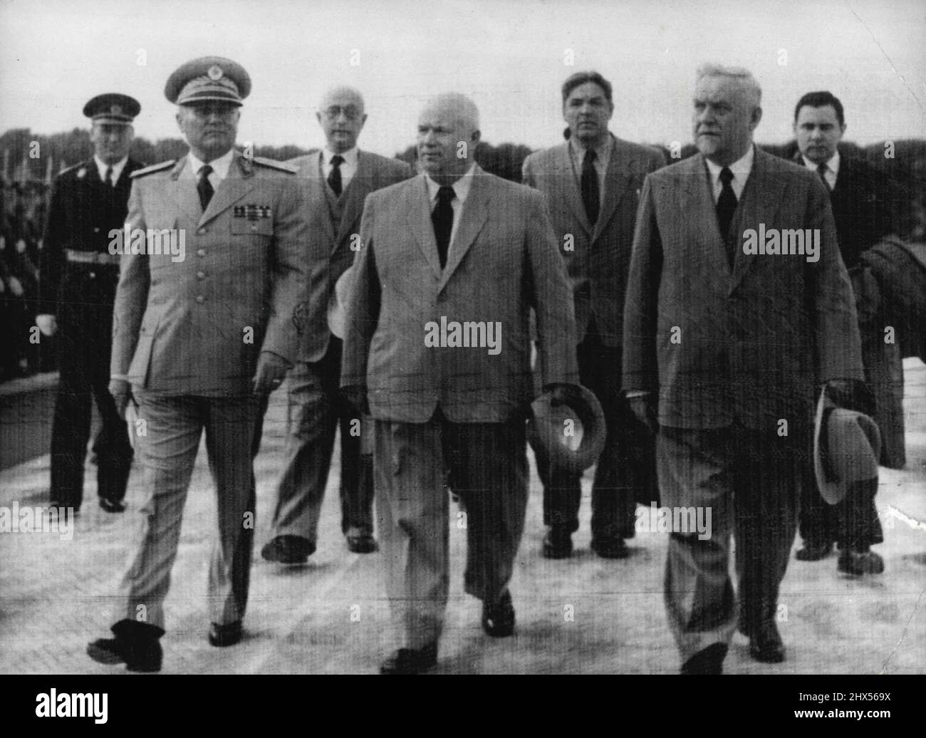 All In Step -- Every Body's in step as Marshal Tito of Yugoslavia, left, Marches with his soviet guests across Tarnac at Belgrade Airport after they hall arrived on a friendship visit to Yugoslavia today, May 26. Nikita Khrushchev, secretary of the Russian visiting delegation at right is the Soviet Prime Minister, Marshal Nikolai Bulganin. At right in the second row is Andrei Gromyko, Deputy Foreign Minister. May 26, 1955. (Photo by Associated Press Photo). Stock Photo