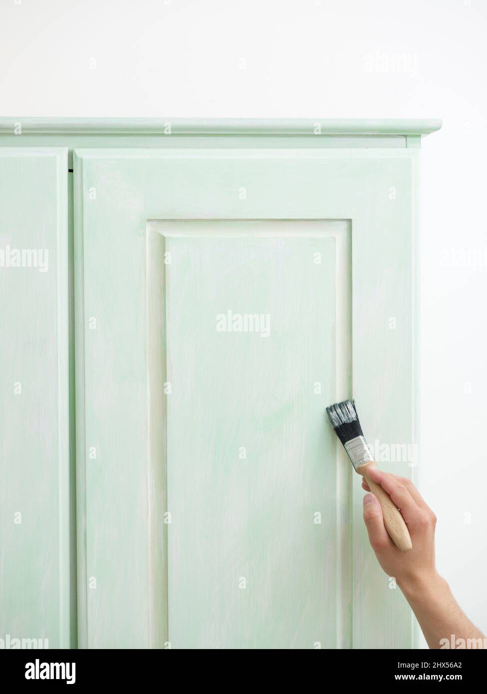 Revamping an old wardrobe, giving it an aged, antique look, painting