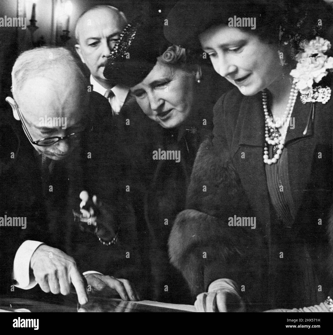 The Queen At the Czechoslovak Institute - Her Majesty the Queen, Madam Benes, Dr. Edward Benes President of the Czechoslovak Republic.Queen Elizabeth visted the Hollar exhibition at the Czechoslovak Institute, London. Her Majesty who was met by the President of Czechoslovakia and Madam Benes examined with interest the works of Wenceslas Hollar, the famous Czech engraver who is buried at St. Margaret's, Westminster.The Examination was organised by Dr. Goldschmidt. Dr. Goldschmidt is now a private in the Czechoslovak army in Great Britain, he is an outstanding authority on Hollar, Many of the ex Stock Photo