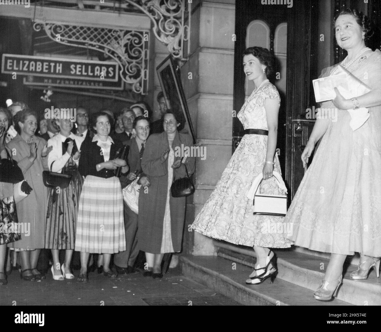 Birthday Treat - The Queen and the Queen Mother leave the new castle theatre, London, after seeing "The remarkable Mr. Pennypacker" last night, August 4. It was the Queen Mother's 55th birthday. August 15, 1955. (Photo by Associated Press Photo). Stock Photo