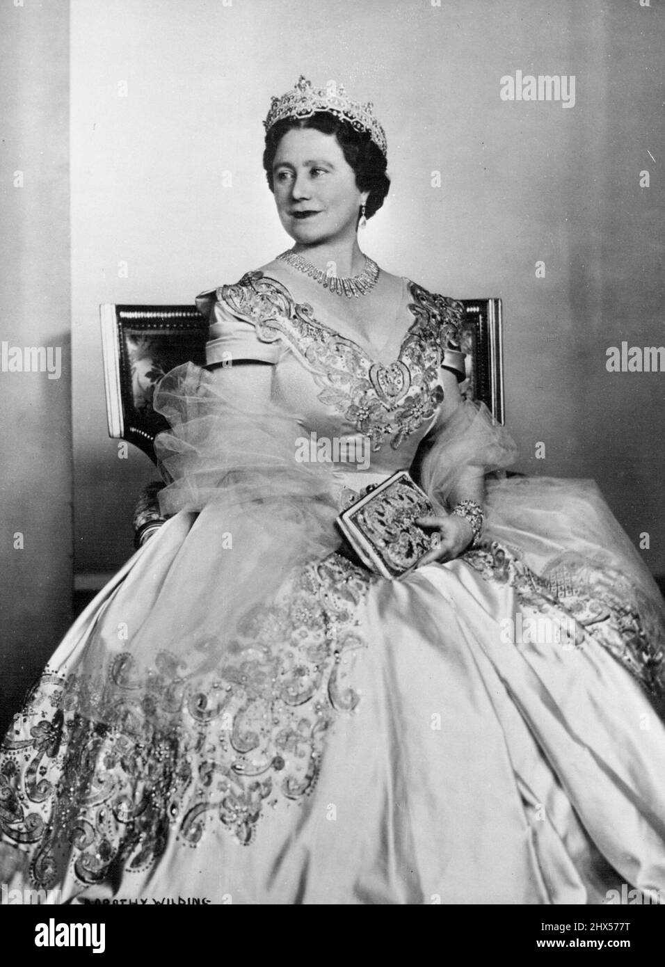 H.M. Queen Elizabeth The Queen Mother -- This new portrait study shows Her  Majesty wearing a picture frock of deep oyster satin embroidered in gold and  silver, with crystal beads; her jewellery