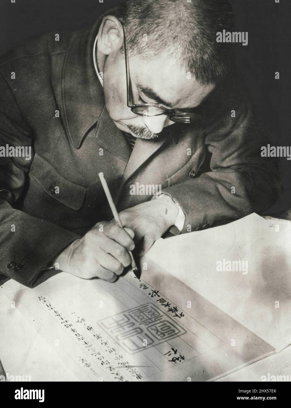 Signing Proclamation -- Foreign Minister Yosuke Matsuoka signs Dec. 29 in Tokyo a Proclamation for the 2, 600th anniversary of the Japanese empire. Matsuoka is dressed in the National Uniform. January 15, 1941. (Photo by Associated Press Photo). Stock Photo