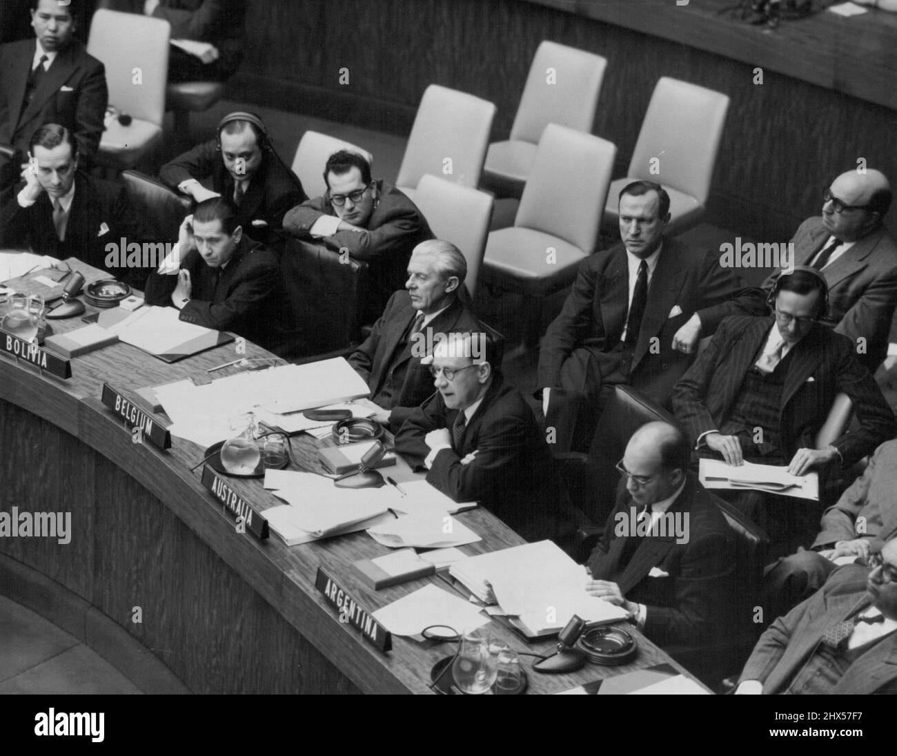 Seventh Session Of U.N. General Assembly (2nd Part) -- Partial view of a meeting of the Assembly's First (Political) Committee on the Korean question, showing Sir Percy Spender, of Australia, addressing the Committees.From left to right, at the conference table, are: Mr. Henrique De Souza Gomes, of Brazil; Dr. Eduardo Arze Quiroga, Permanent Representative of Bolivia to the U.N.; Mr. Fernand van Langenhove, Permanent Representative of Belgium; Sir Percy Spender; Dr. Rodolfo Munoz, Permanent Representative of Argentina; and Mr. Mohammed Kabir Ludin, Permanent Representative of Afghanistan.Sir P Stock Photo